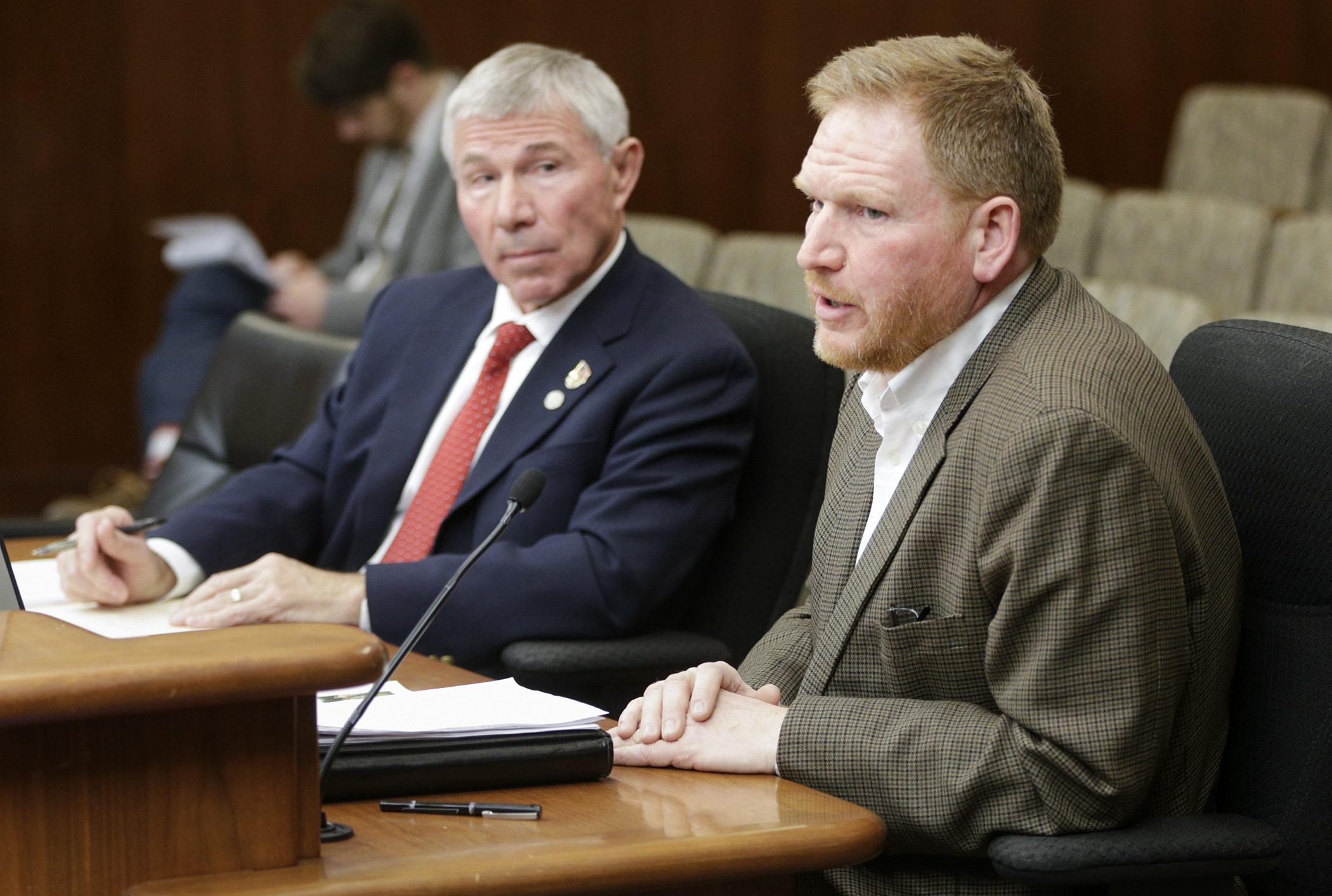 David Kelliher, legislative director for the Minnesota Historical Society, testifies during the House Veterans Affairs Division hearing March 22 on HF4100, sponsored by Rep. Bob Dettmer, left. Photo by Paul Battaglia