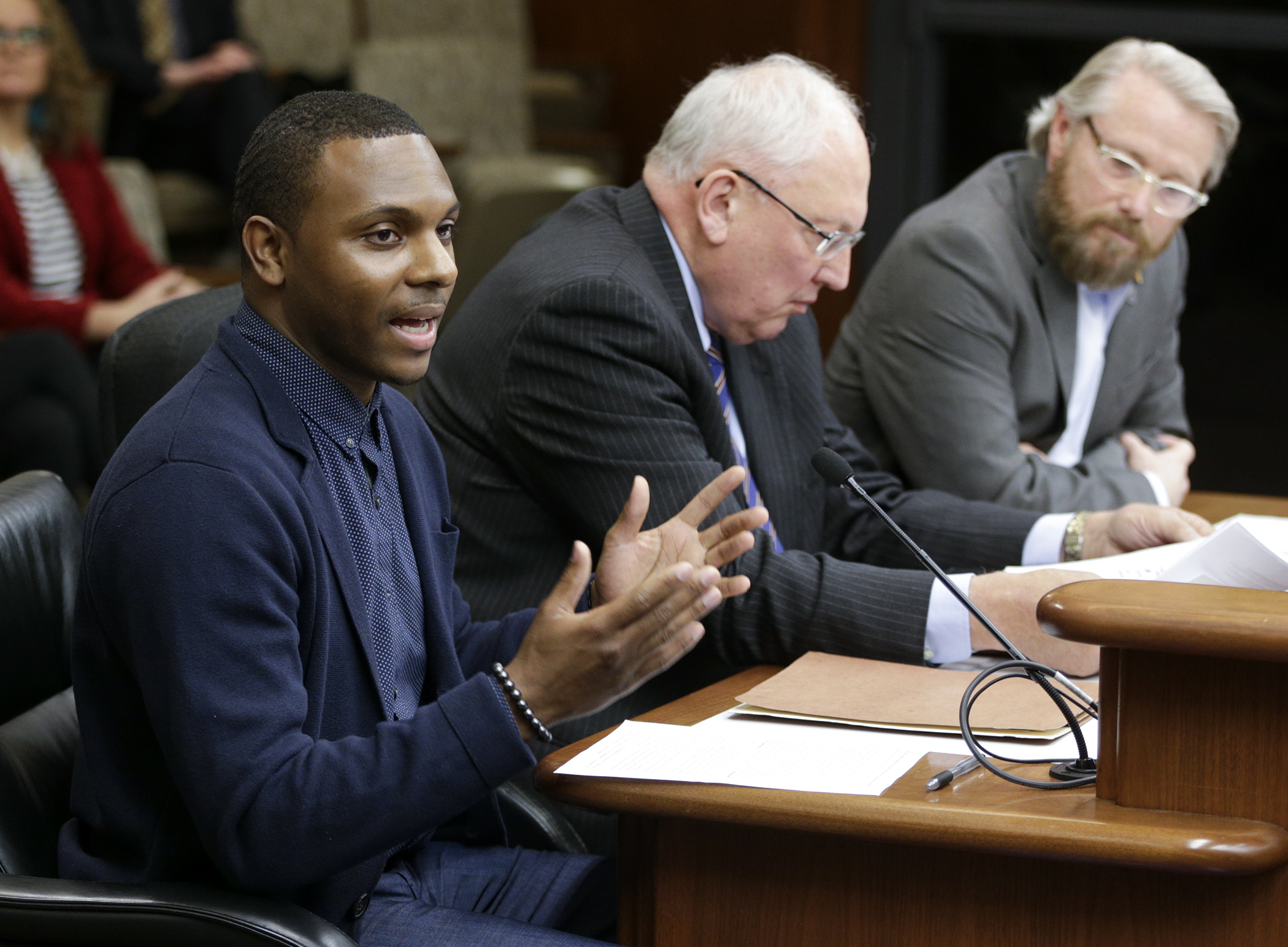 Elizer Darris, an organizer with the American Civil Liberties Union, testifies in favor of HF951, sponsored by Rep. Raymond Dehn, right, to restore the right to vote after an individual has been released from incarceration. Photo by Paul Battaglia