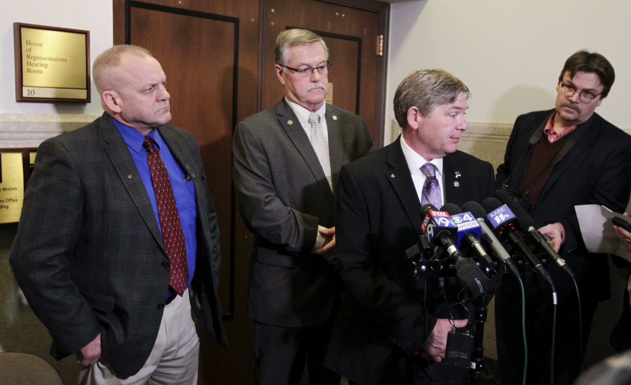 Rep. Matt Grossell, from left, Sen. Bill Ingebrigtsen and Rep. Brian Johnson discuss a pair of police-protection bills with the media before a March 22 committee hearing. Photo by Paul Battaglia