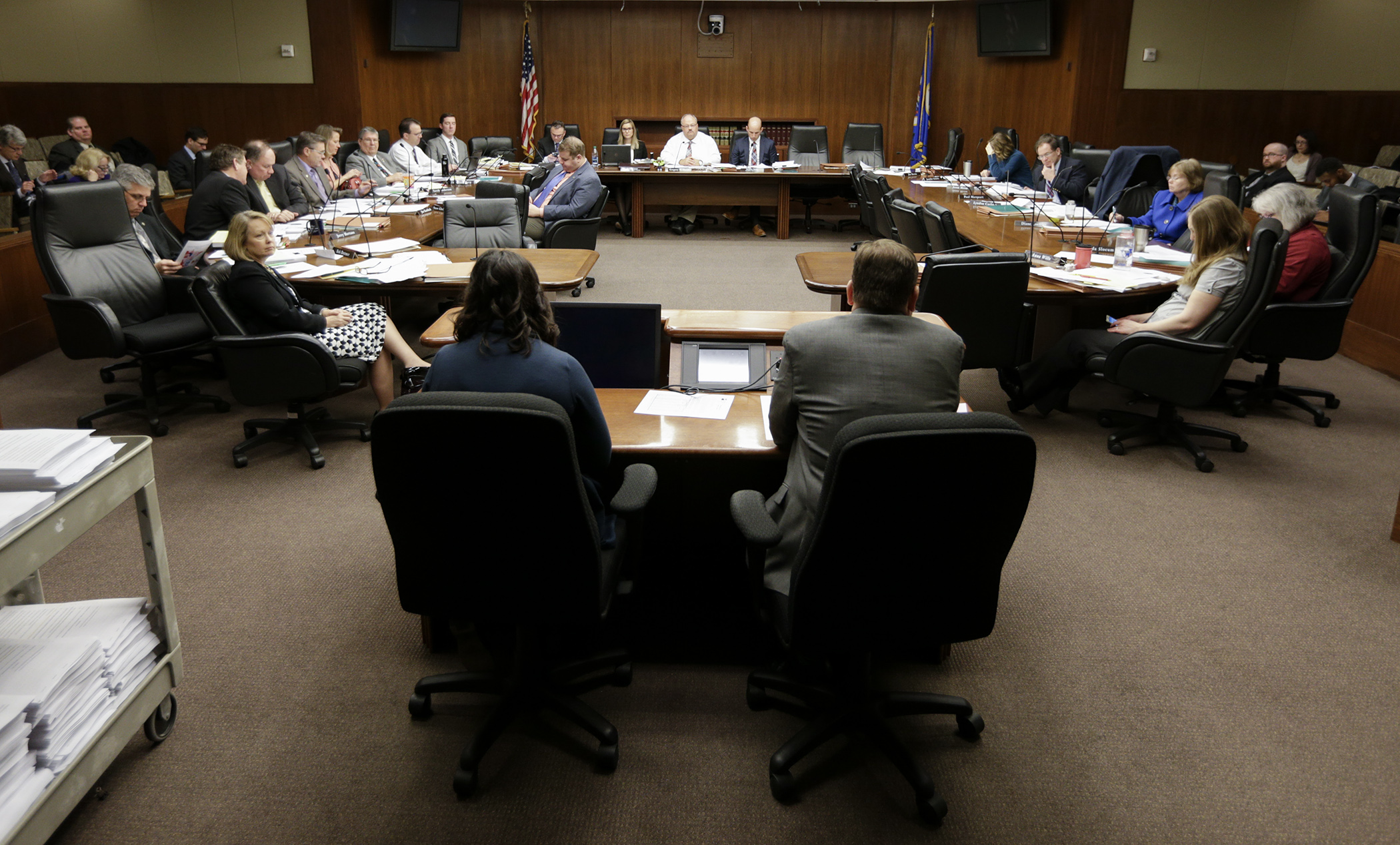 Members of the House Taxes Committee listen to testimony on the omnibus bill during a March 23 hearing. Photo by Paul Battaglia