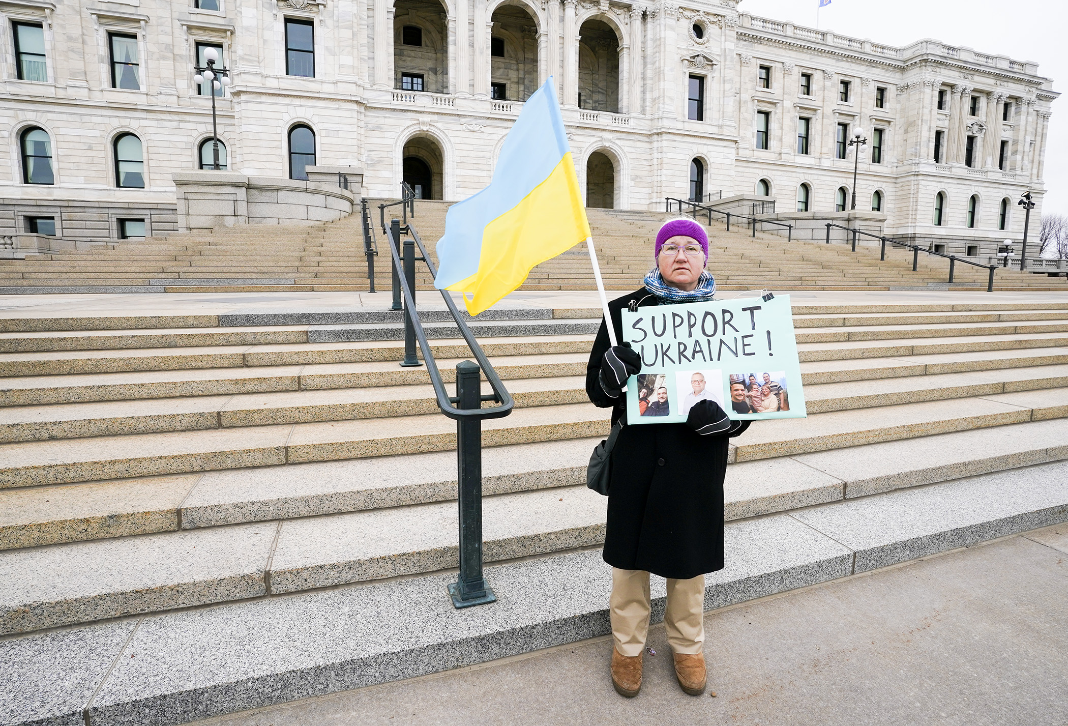 Sharon Aaseng, of Hastings, heeded Ukraine President Volodymyr Zelensky’s call for people around the world to turn out in support of Ukraine, as she parades in front of the State Capitol March 24. (Photo by Paul Battaglia)
