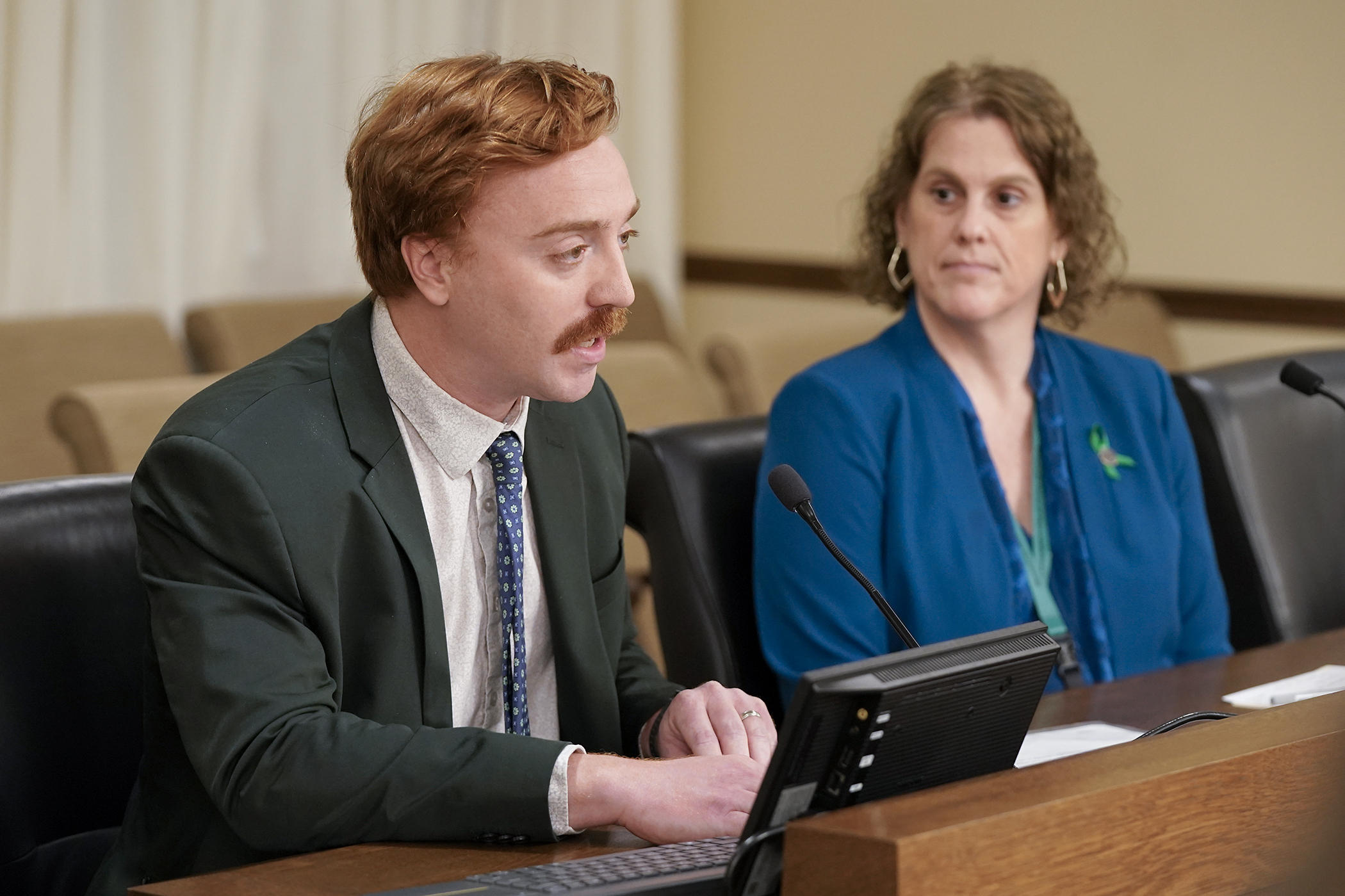 Mark Foster, vice president of legislative and political affairs at Housing First Minnesota, speaks for a bill sponsored by Rep. Kari Rehrauer to waive permit fees for home upgrades to accommodate veterans with a disability. (Photo by Michele Jokinen)