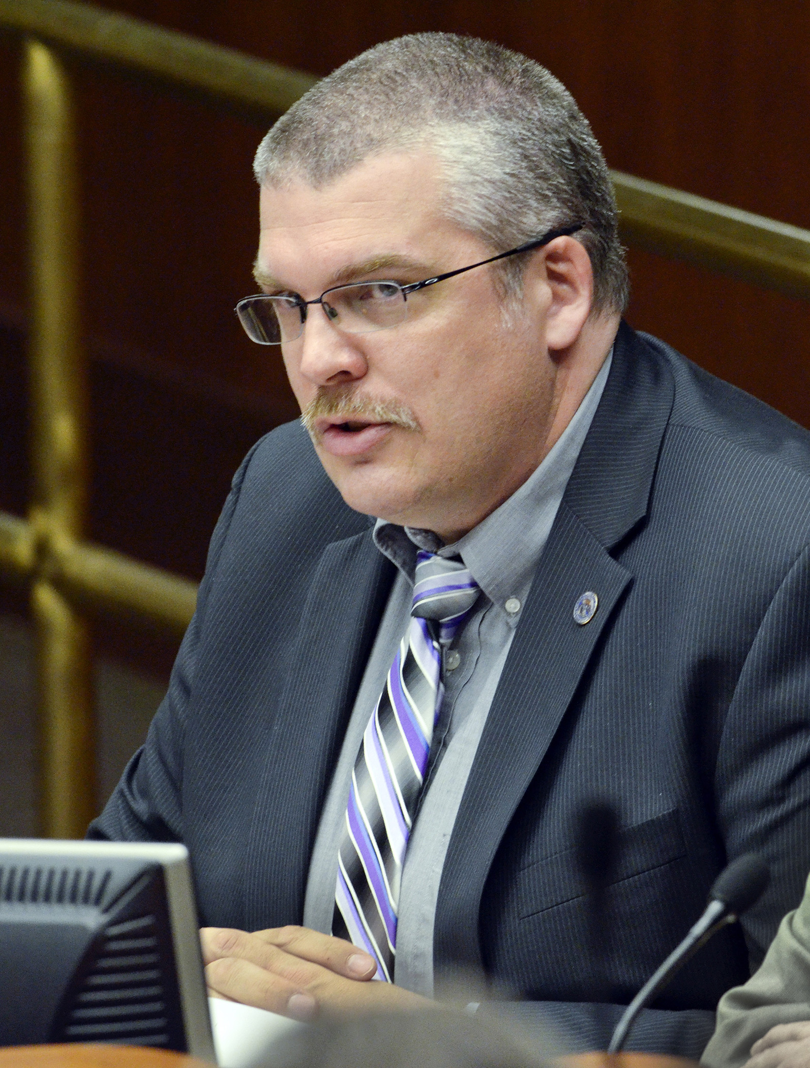 Rep. Erik Simonson testifies before the House Labor, Workplace and Regulated Industries Committee March 6  in support of a bill that would expand broadband service to underserved areas. Photo by Andrew VonBank
