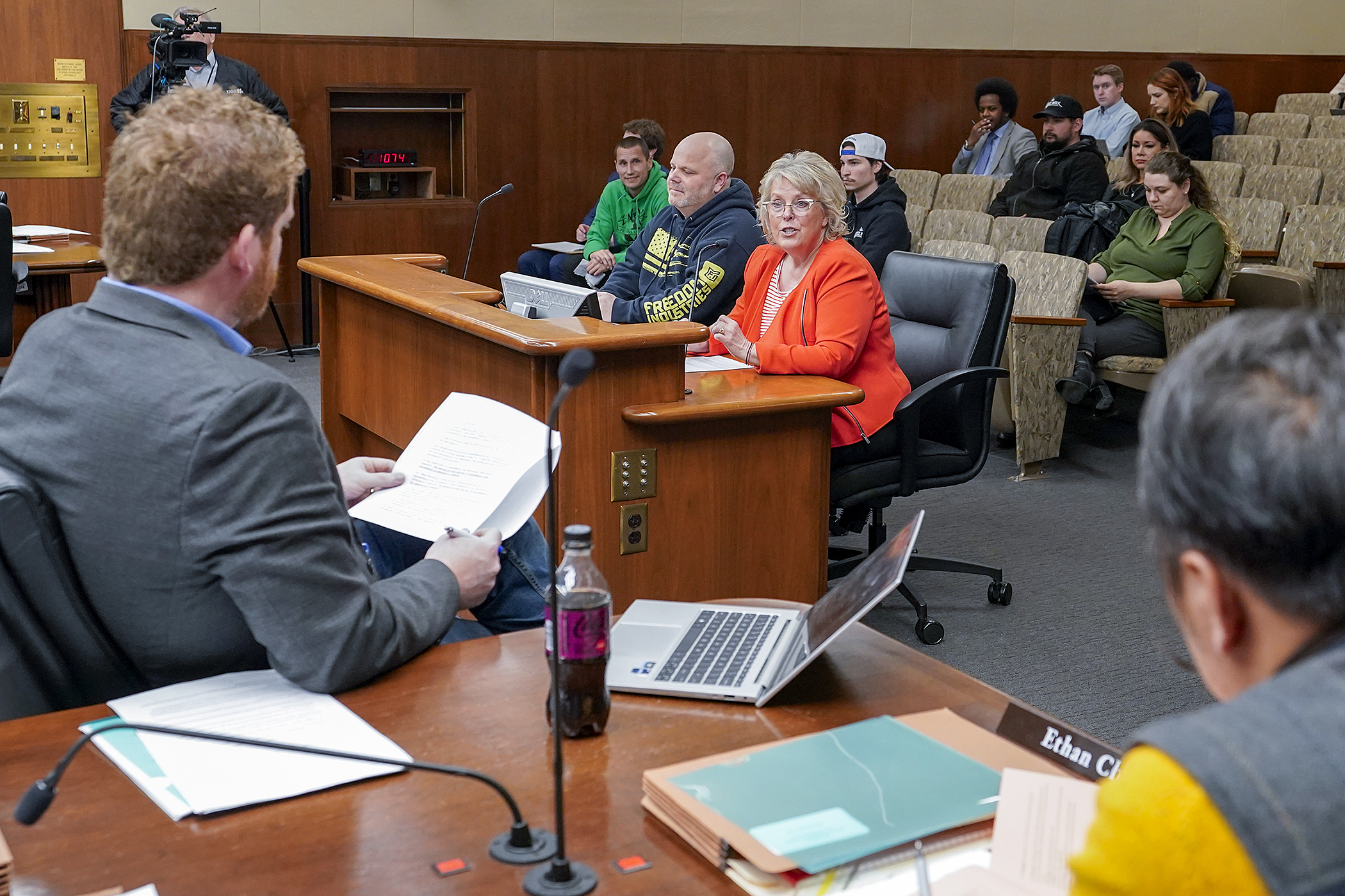 Charlene Briner, interim director of the Office of Cannabis Management, testifies before the House Commerce Finance and Policy Committee March 27 regarding HF4757, the cannabis policy bill. Rep. Zack Stephenson, foreground, is the sponsor. (Photo by Michele Jokinen)
