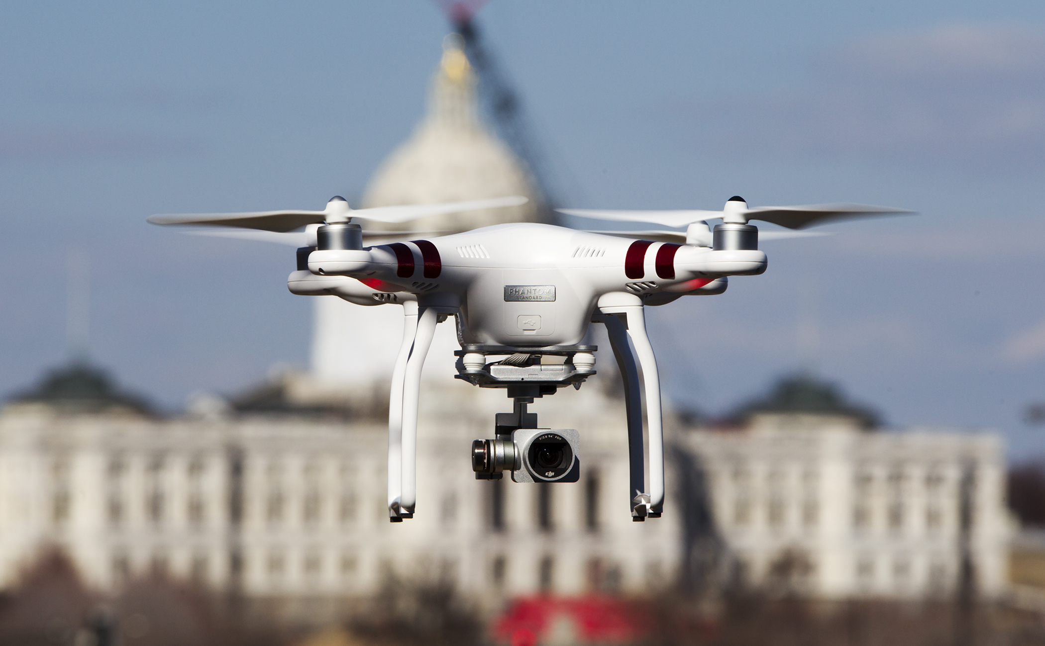 A drone pictured near the State Capitol. The House Transportation Policy and Finance Committee on Tuesday approved a bill that proposes to further regulate the unmanned aircraft. Photo by Paul Battaglia