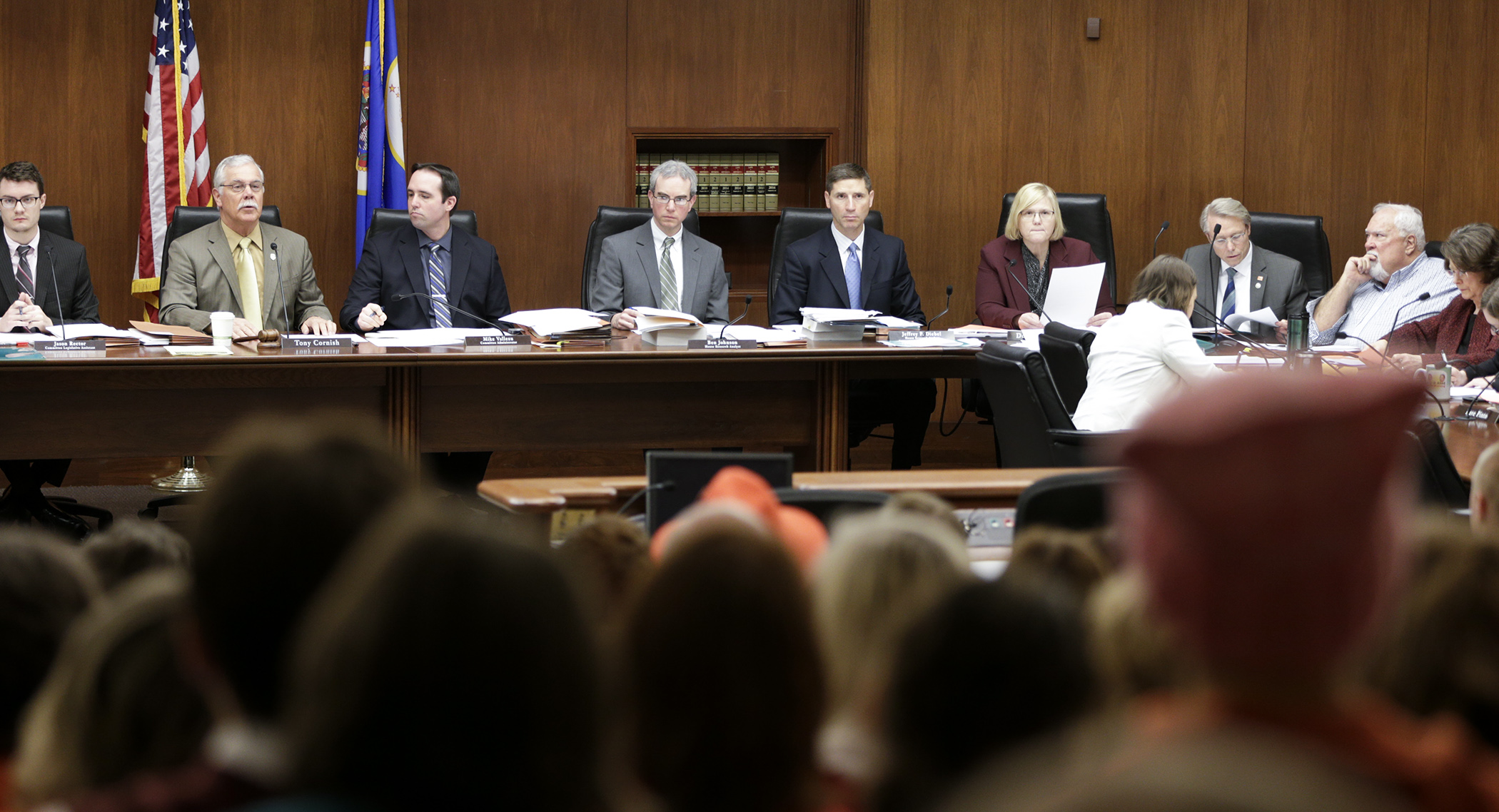 Members of the House Public Safety and Security Policy and Finance Committee finish work on their omnibus bill before a packed committee room March 28. Photo by Paul Battaglia