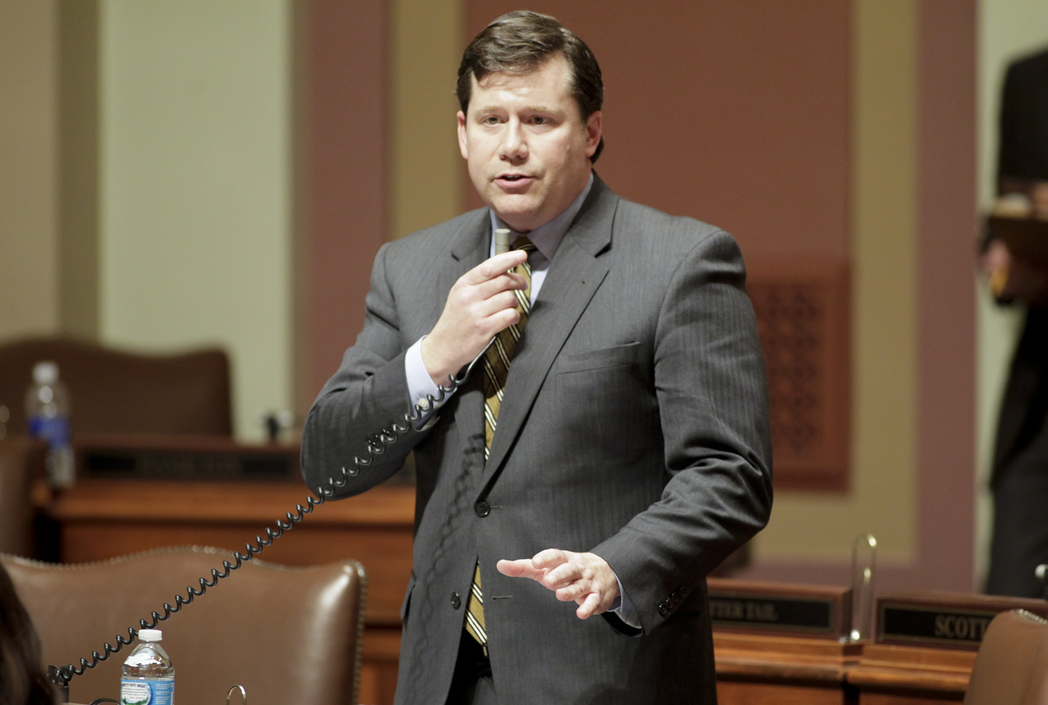 Rep. Dennis Smith discusses HF1732/SF1646*, the Real ID bill, on the House Floor March 29. The bill was passed, as amended, 125-2. Photo by Paul Battaglia