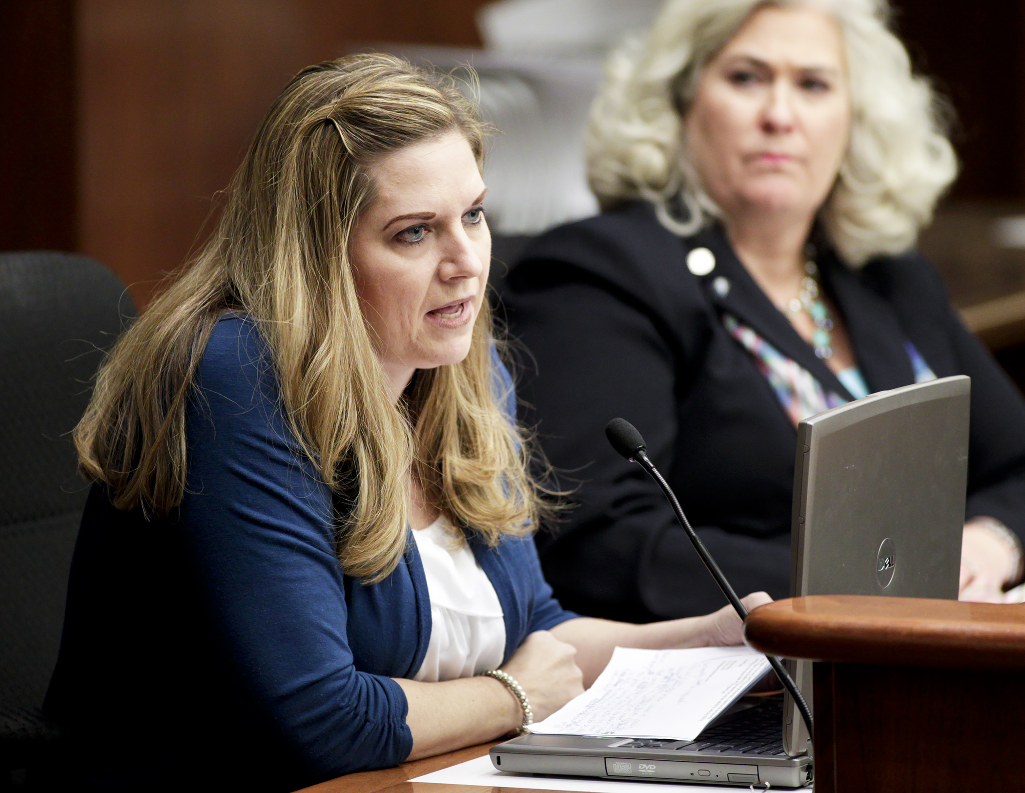 Melissa Sirek, the mother of three children with autism, testifies before the House Education Finance Committee for HF1529, sponsored by Rep. Kelly Fenton, right, to create education savings accounts for students with special needs. Photo by Paul Battaglia