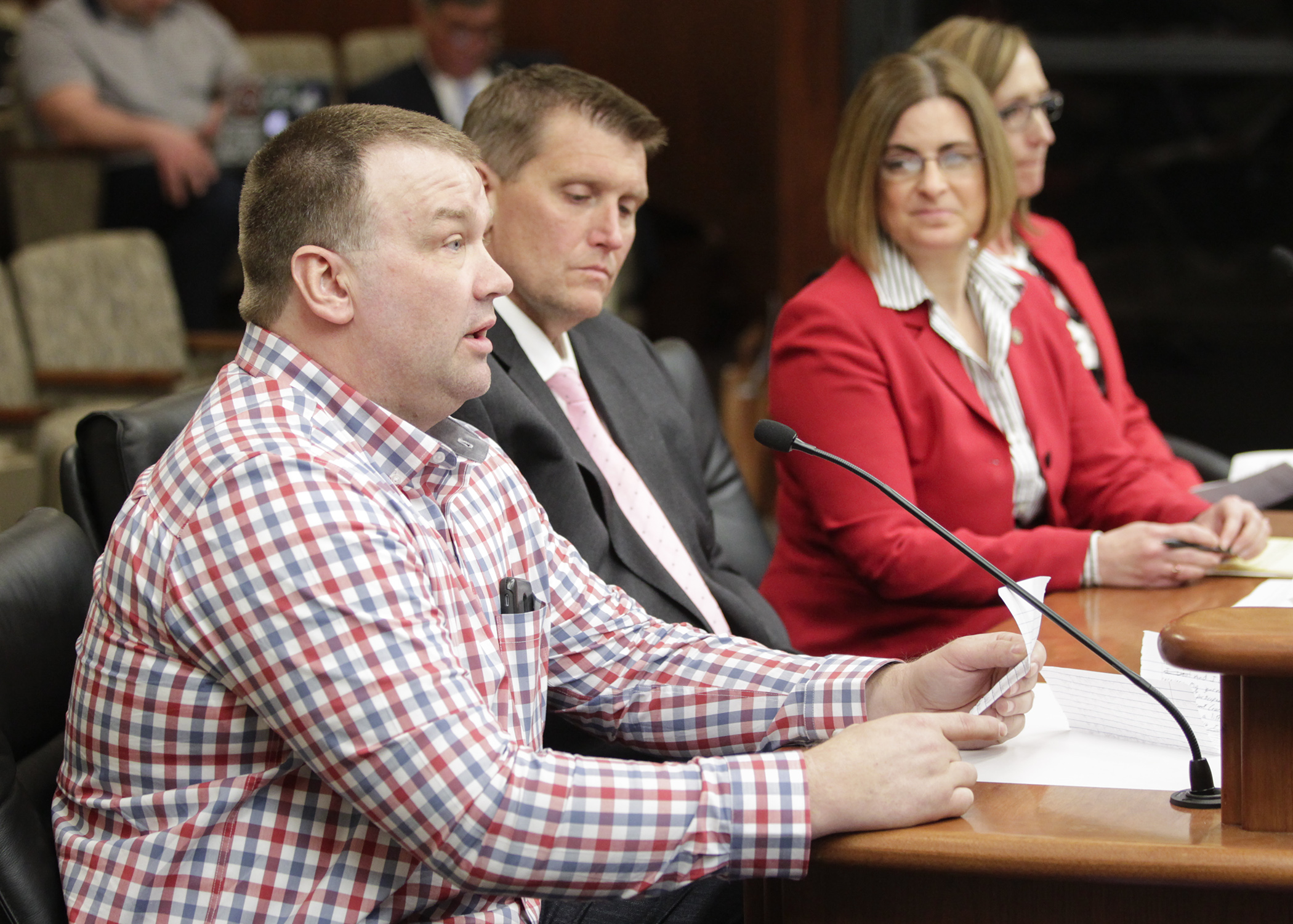 Jared Forner testifies April 3 before the House Judiciary Finance and Civil Law Division on HF1349, sponsored by Rep. Marion O’Neill, second right, which would appropriate money for treatment courts. Photo by Paul Battaglia