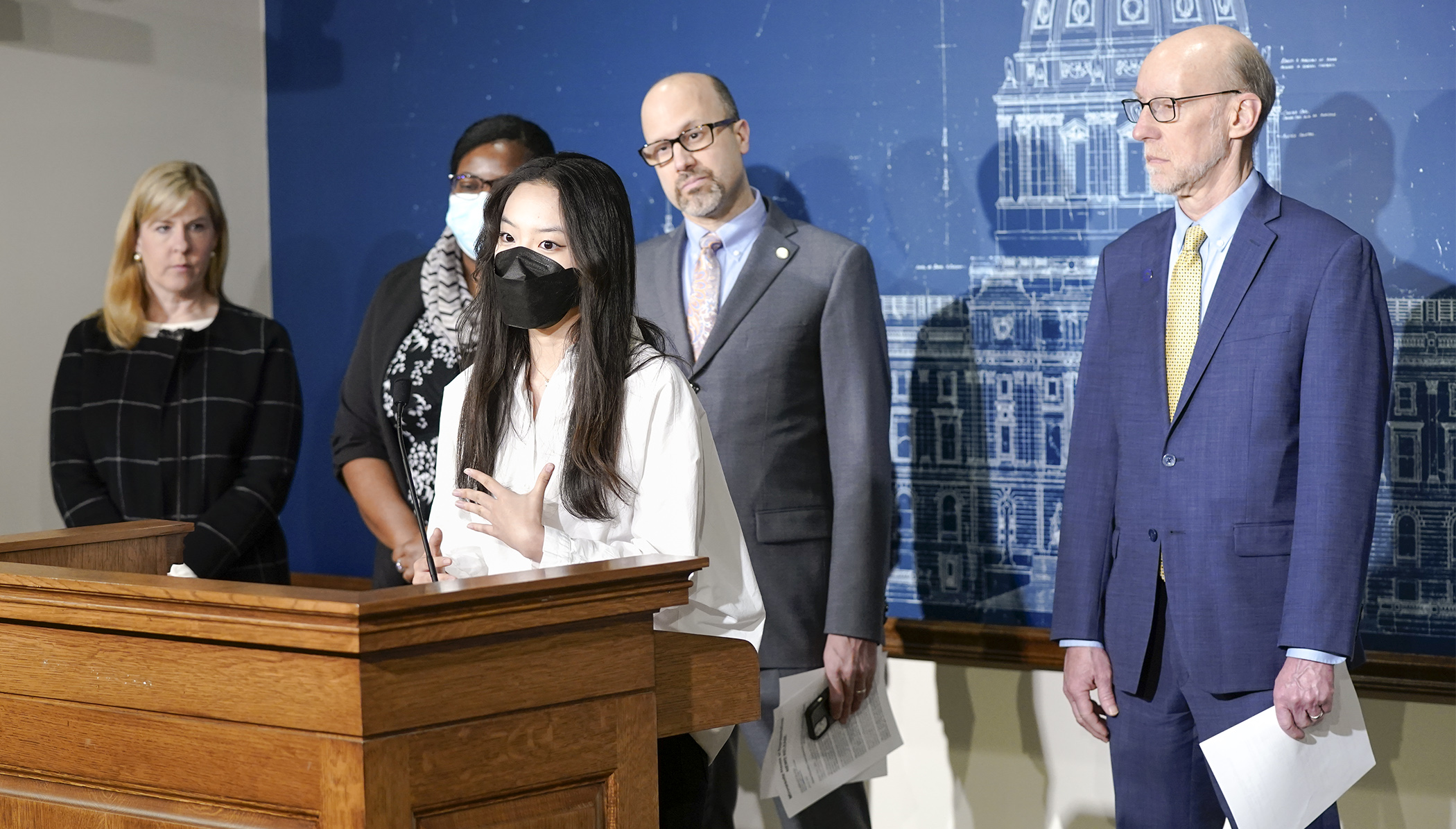 Chae Lee, a senior at Minnetonka High School, describes her school experiences during a March 4 press conference where the DFL announced its $1.15 billion, E-12 education finance and policy proposal. (Photo by Paul Battaglia)