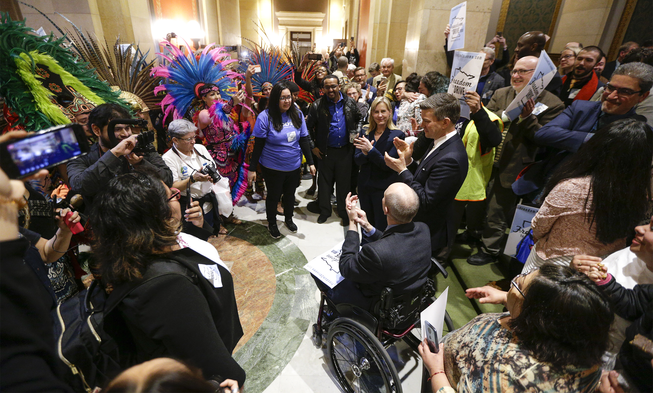 A large crowd greeted members as they left the House Chamber April 5 after the so-called “Drivers Licenses for All” bill, HF1500, passed 74-52. Photo by Paul Battaglia