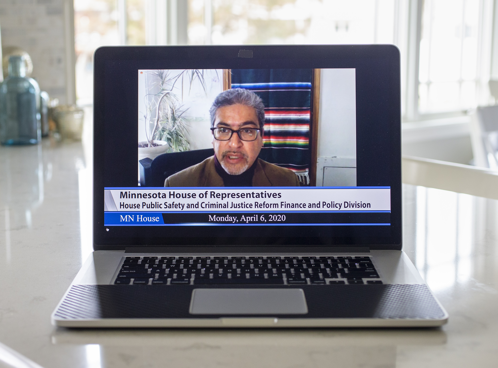 Legislators got back to meeting this week — but remotely. Here, Rep. Carlos Mariani, chair of the House public safety division, is pictured during the panel's April 6 meeting via teleconference. Photo by Paul Battaglia