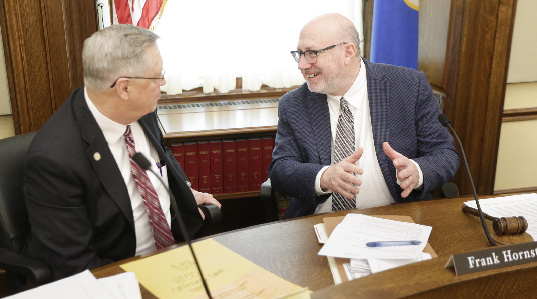 Rep. Frank Hornstein, right, and Sen. Scott Newman, co-chairs of the conference committee on HF50, confer after coming to an agreement and adopting the committee report. April 8. Photo by Paul Battaglia