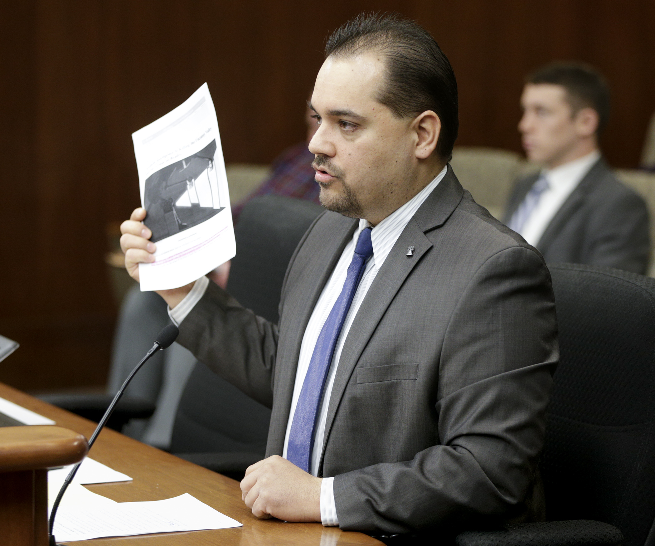 Rep. Eric Lucero testifies April 10 before the House Public Safety and Security Policy and Finance Committee in support of HF3425, a bill to make it a crime to misrepresent a digital picture or recording. Photo by Paul Battaglia