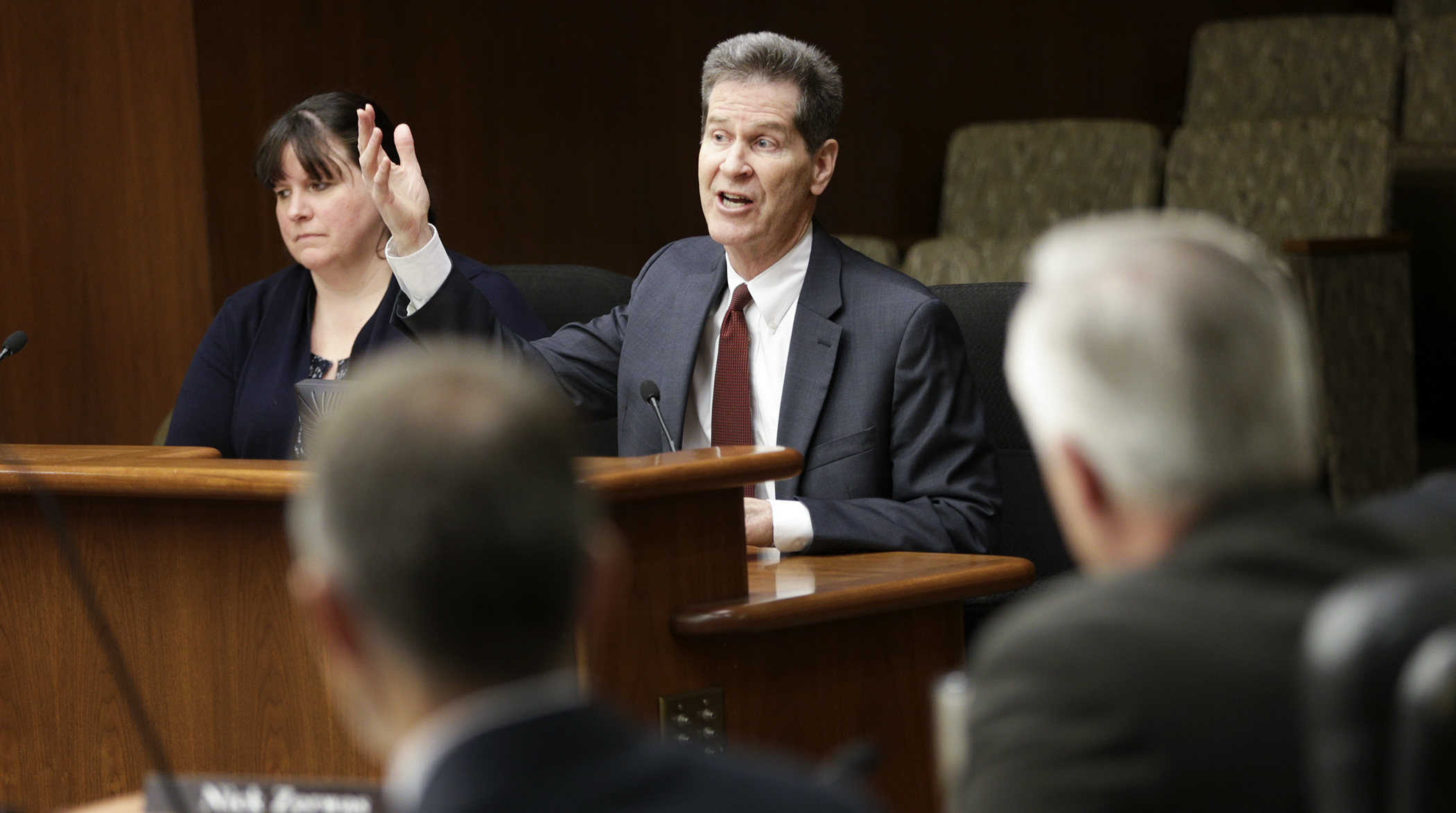 Larry Pogemiller, commissioner of the Office of Higher Education, answers a question on the governor's higher education supplemental budget request during testimony before the House higher education committee. Photo by Paul Battaglia