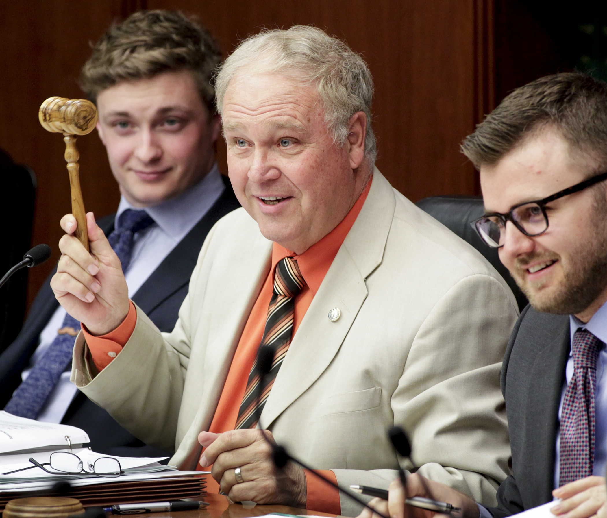 Rep. Dean Urdahl displays a new gavel made of wood from the Holy Land, given to him by his wife as a Christmas gift, after using it to begin the April 11 meeting of the House Legacy Funding Finance Committee. Photo by Paul Battaglia