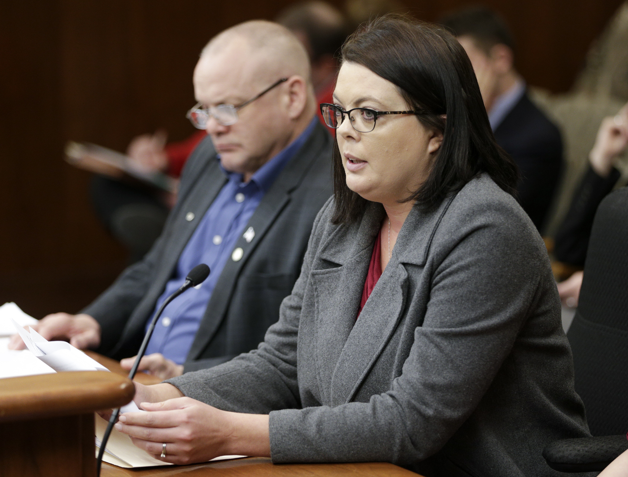 Nicole McKinnon shares the story of what happened to her teenage daughter with the House Public Safety and Security and Policy Finance Committee during its April 11 discussion of a bill to increase penalties for child pornography offenses. Rep. Matt Grossell, left, is the sponsor. Photo by Paul Battaglia