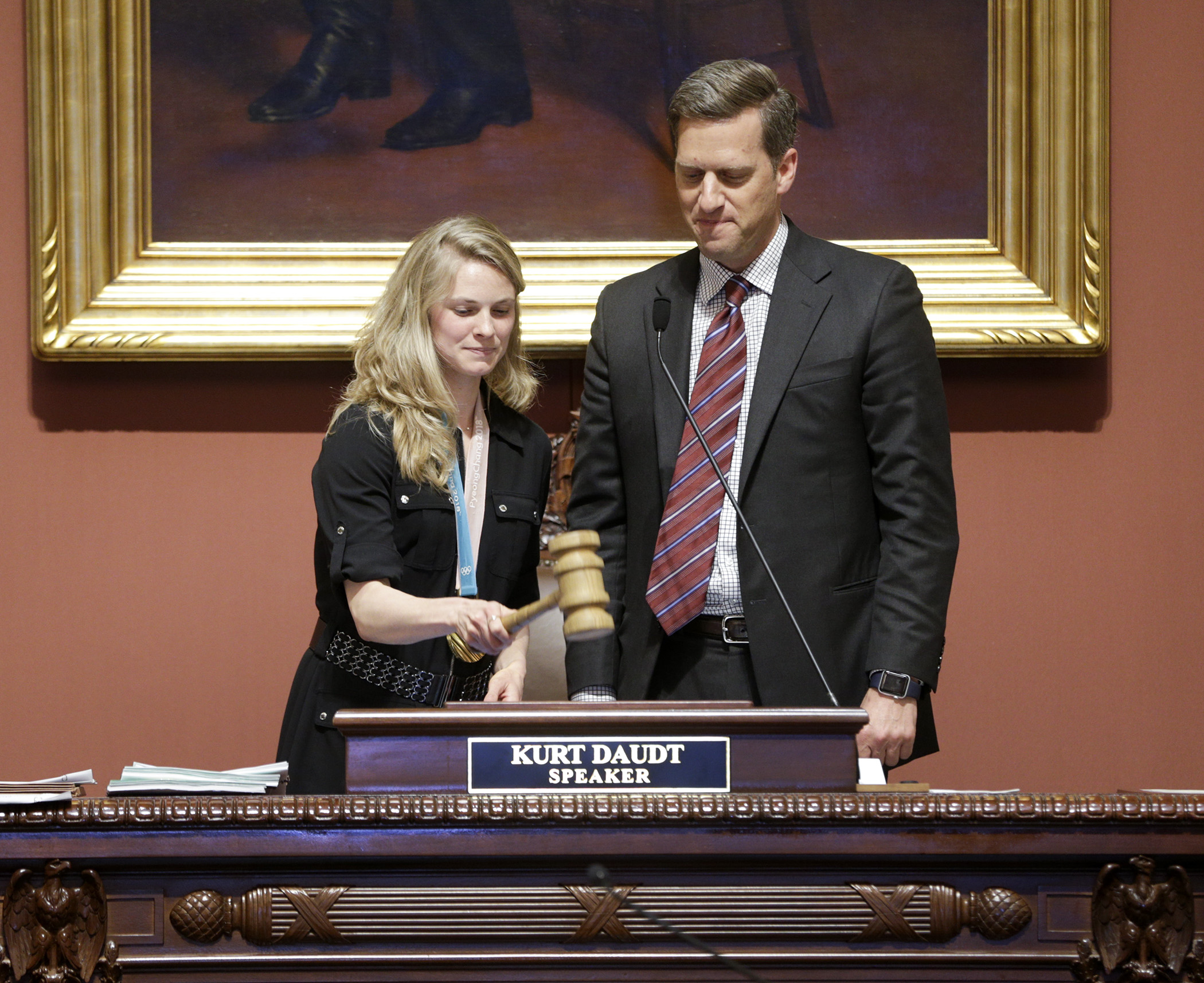 Olympic cross-country skiing gold medalist and Afton native Jessie Diggins gavels in the House floor session April 12 as House Speaker Kurt Daudt looks on. Photo by Paul Battaglia