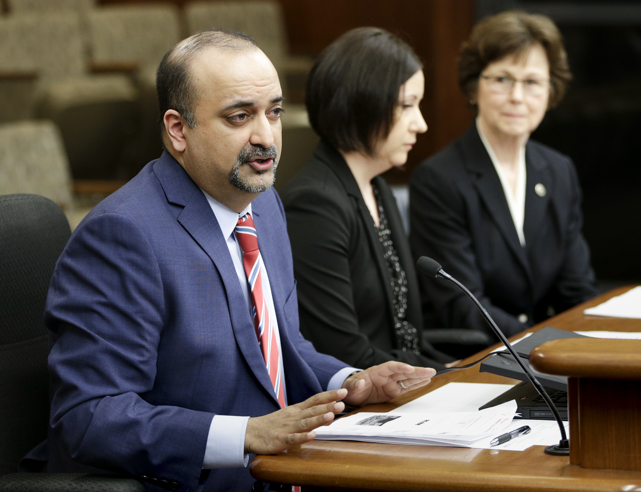 Imran Ali, director of the East Metro Sex Trafficking Task Force, testifies April 12 before the House public safety committee on a bill, sponsored by Rep. JoAnn Ward, right, to increase the penalties for patrons of prostitution. Photo by Paul Battaglia