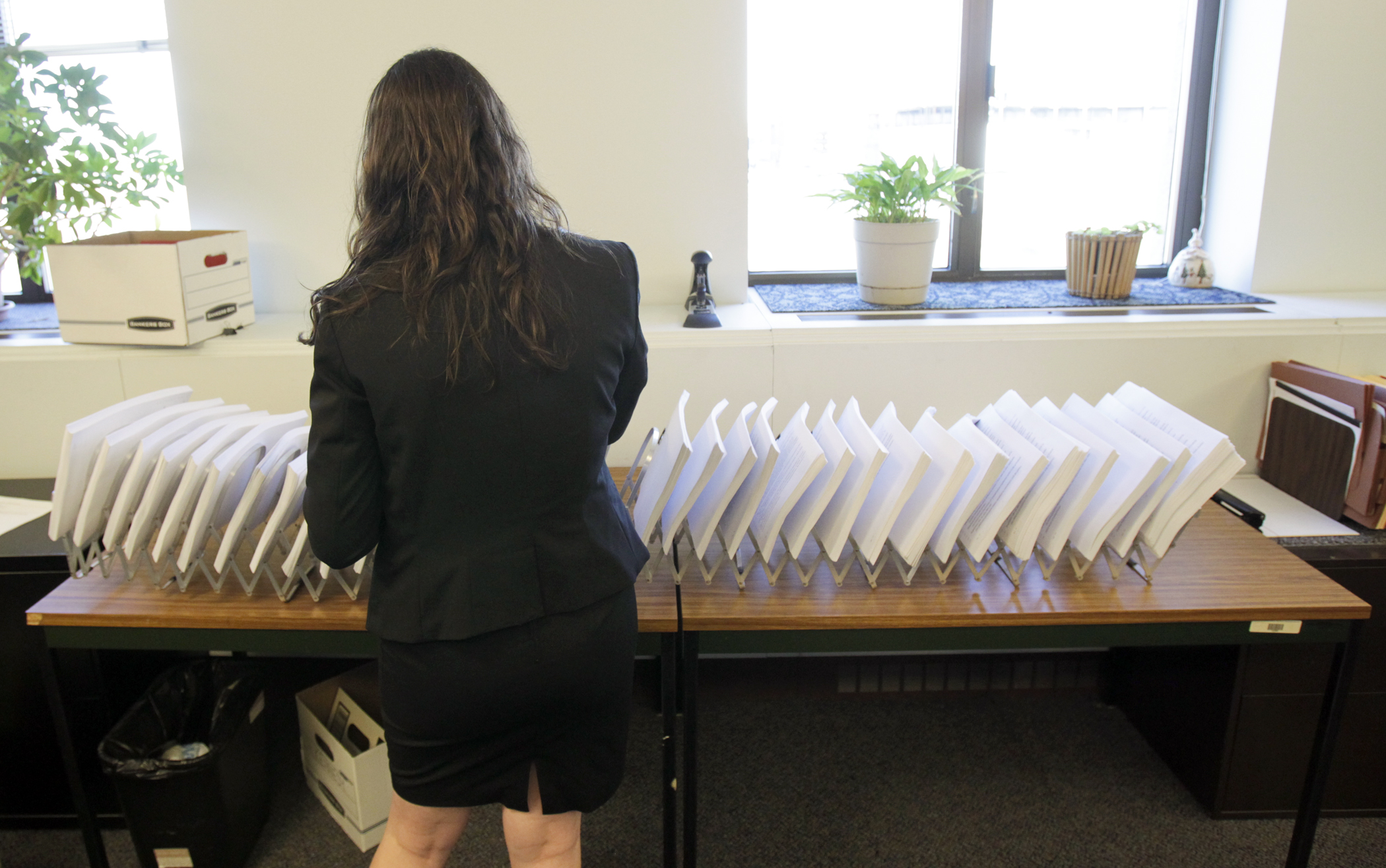 House Transportation Policy and Finance Committee Legislative Assistant Natalie Cecchini prepares amendments scheduled to be taken up at the April 13 committee meeting. Photo by Paul Battaglia