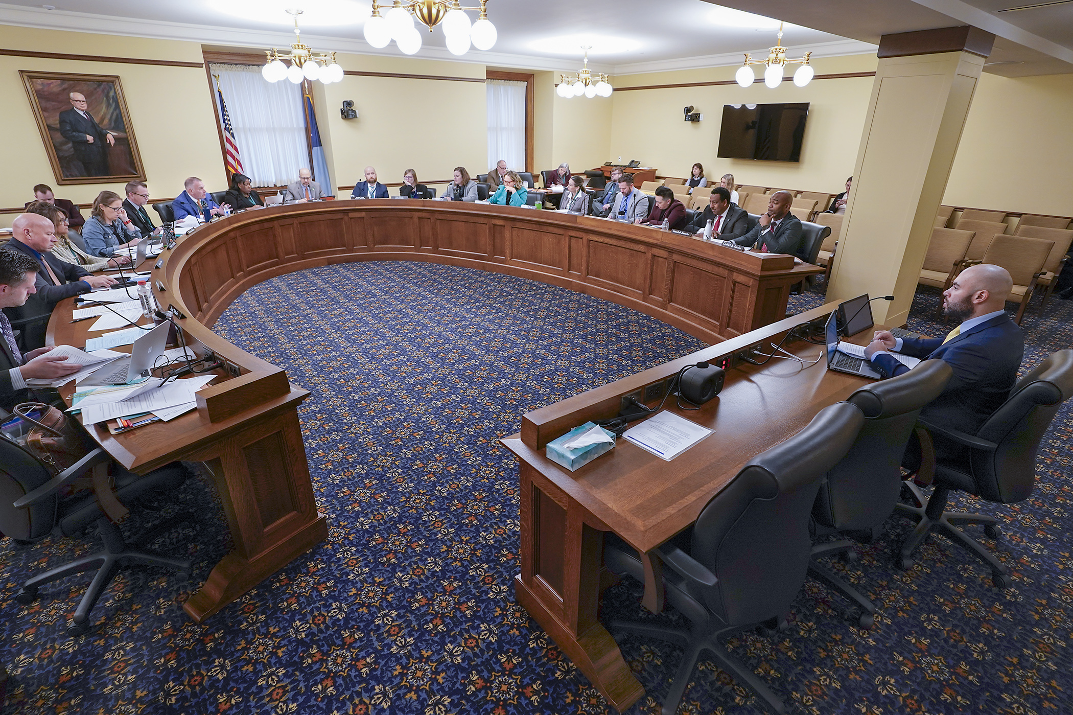 Deven Bowdry, government relations director for the Department of Employment and Economic Development, testifies Thursday before the House Workforce, Labor, and Economic Development Finance and Policy Committee regarding HF3732, the committee’s finance and policy bill. (Photo by Michele Jokinen)