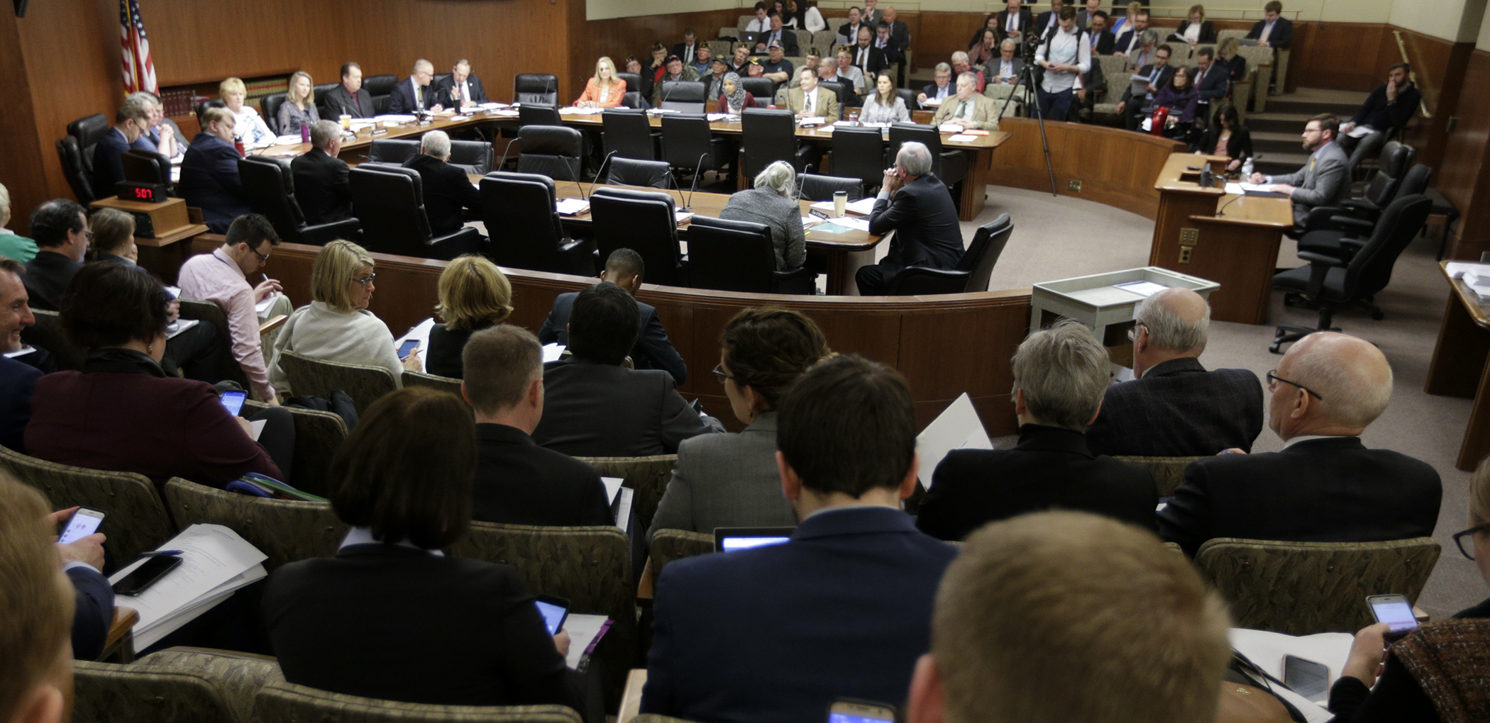 Members of the House State Government Finance Committee listen to public testimony on HF4016, the omnibus state government finance bill, April 18. Photo by Paul Battaglia