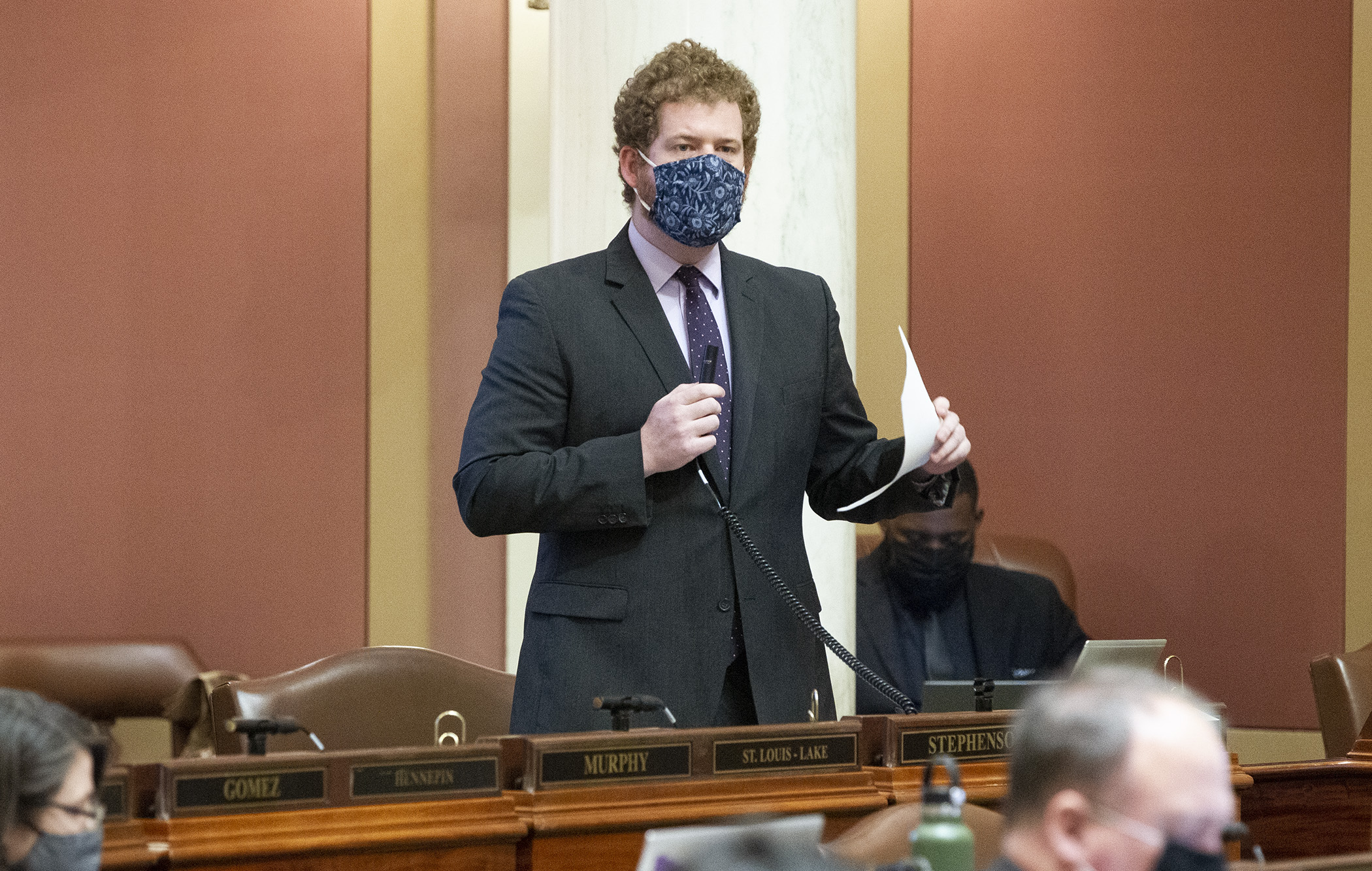 Rep. Zack Stephenson, chair of the House Commerce Finance and Policy Committee, makes opening comments during the April 21 floor debate on the omnibus energy and commerce policy and finance bill. Photo by Paul Battaglia