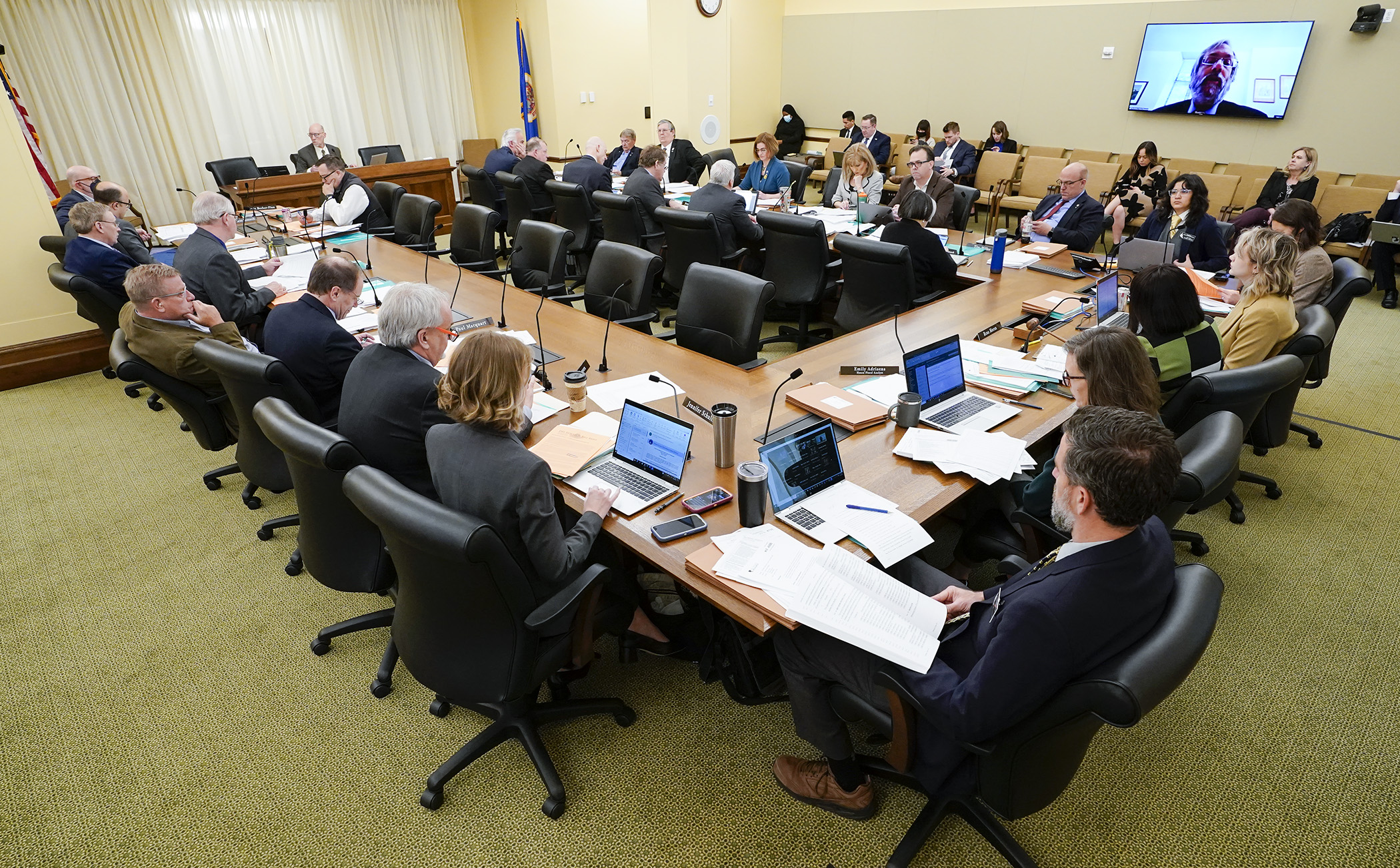 Members of the House Ways and Means Committee discuss provisions of the omnibus early childhood and education finance and policy bills April 21. (Photo by Paul Battaglia)