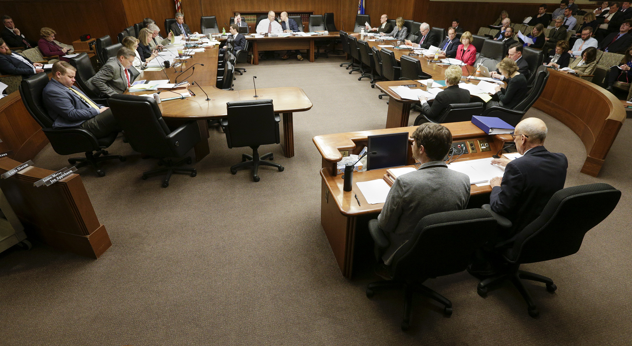 Members of the House Taxes Committee listen April 24 as staff provides an overview of the omnibus tax bill. Photo by Paul Battaglia