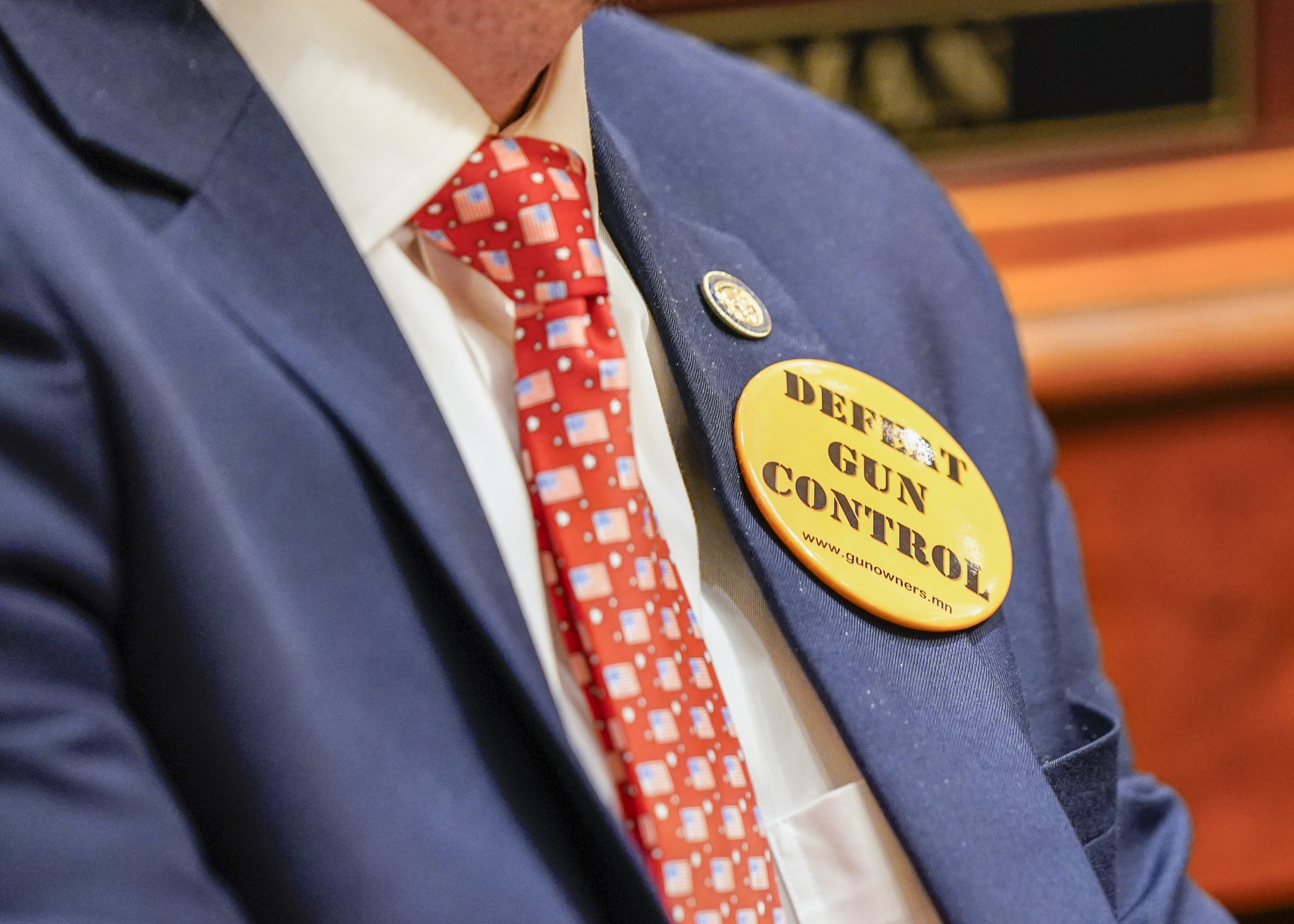 Rep. Isaac Schultz wears an anti-gun control button during debate on the omnibus judiciary and public safety finance and policy bill April 26. (Photo by Catherine Davis)