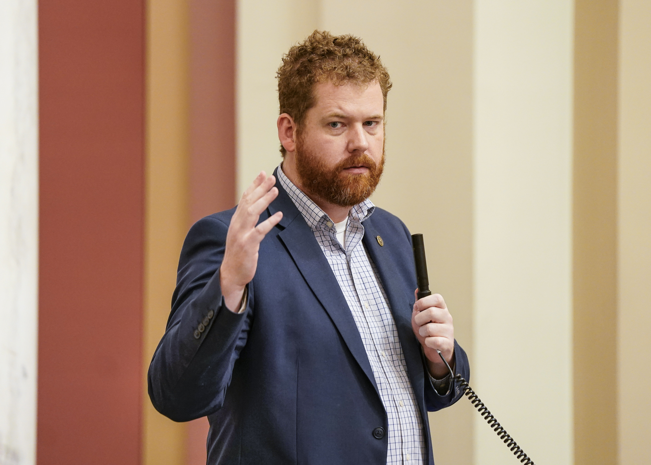 Speaking from the House Floor, Rep. Zack Stephenson urges his colleagues to vote for SF2744, the omnibus commerce finance bill, April 27. (Photo by Catherine Davis)