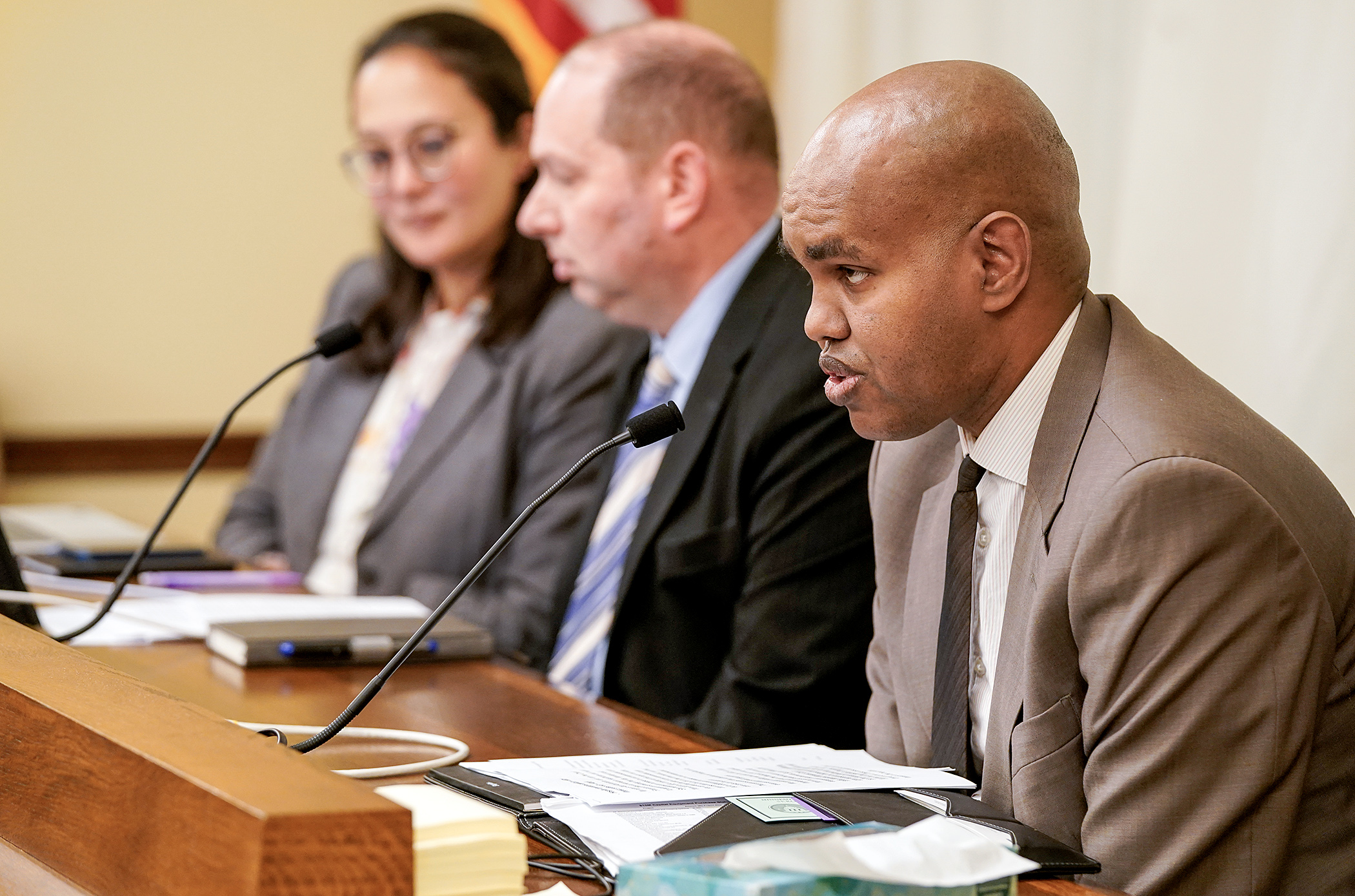 Abdirahman Abdi, chief financial officer of Hennepin Healthcare, speaks before the House Health Finance and Policy Committee Tuesday during a presentation on Hennepin County Medical Center finances. (Photo by Michele Jokinen)