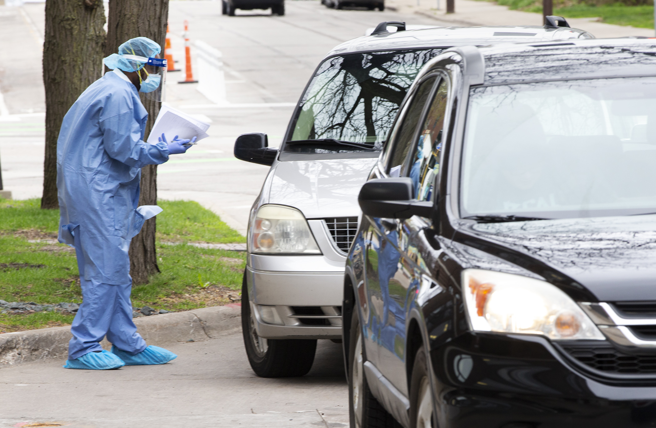 Information is gathered from a client at the drive-up COVID-19 testing site at the People’s Center Clinics and Services in Minneapolis April 29. Photo by Paul Battaglia