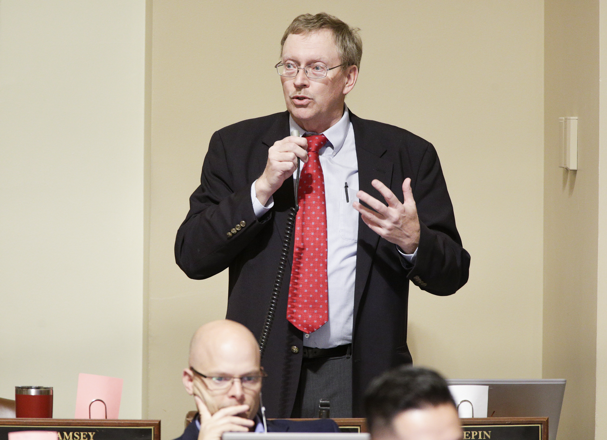 Rep. Michael Nelson, chair of the House State Government Finance Division, comments during floor debate on HF1935/SF2227*, the omnibus state government and veterans and military affairs finance bill. It was passed 73-58. Photo by Paul Battaglia