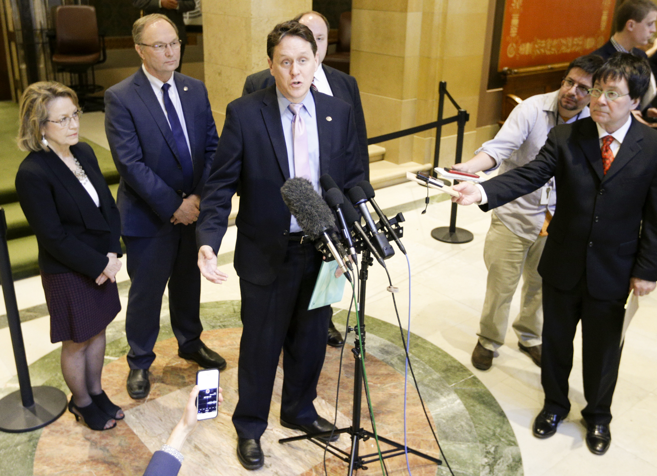 Rep. Matt Dean, center, along with left to right, Reps. Linda Runbeck, Paul Torkelson and Joe Schomacker meet with the press prior to floor debate May 1 on the omnibus health and human services and transportation finance bill. Photo by Paul Battaglia
