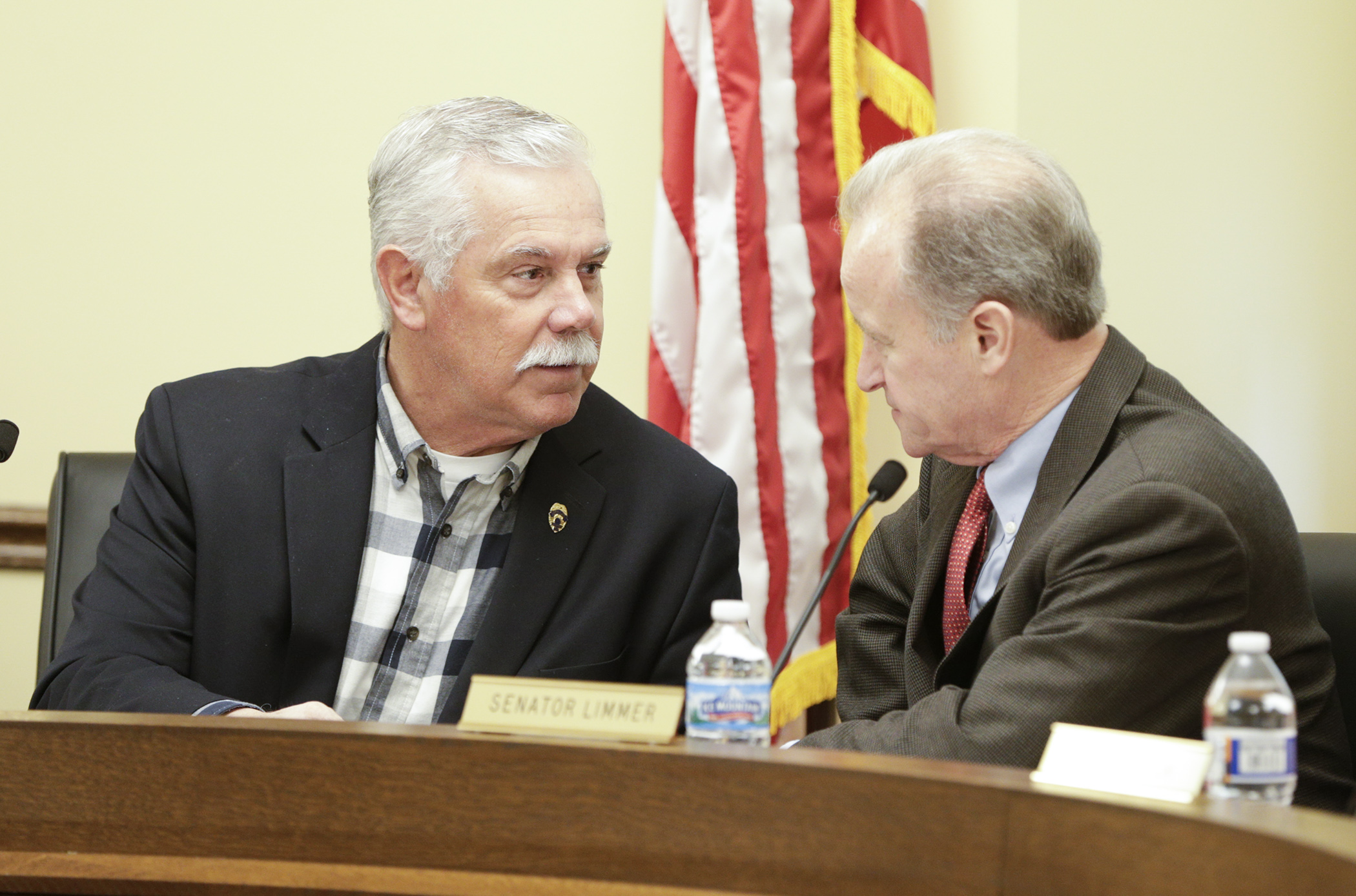 Rep. Tony Cornish and Sen. Warren Limmer, co-chairs of the omnibus public safety conference committee, confer before the start of the May 2 meeting. House Photography file photo