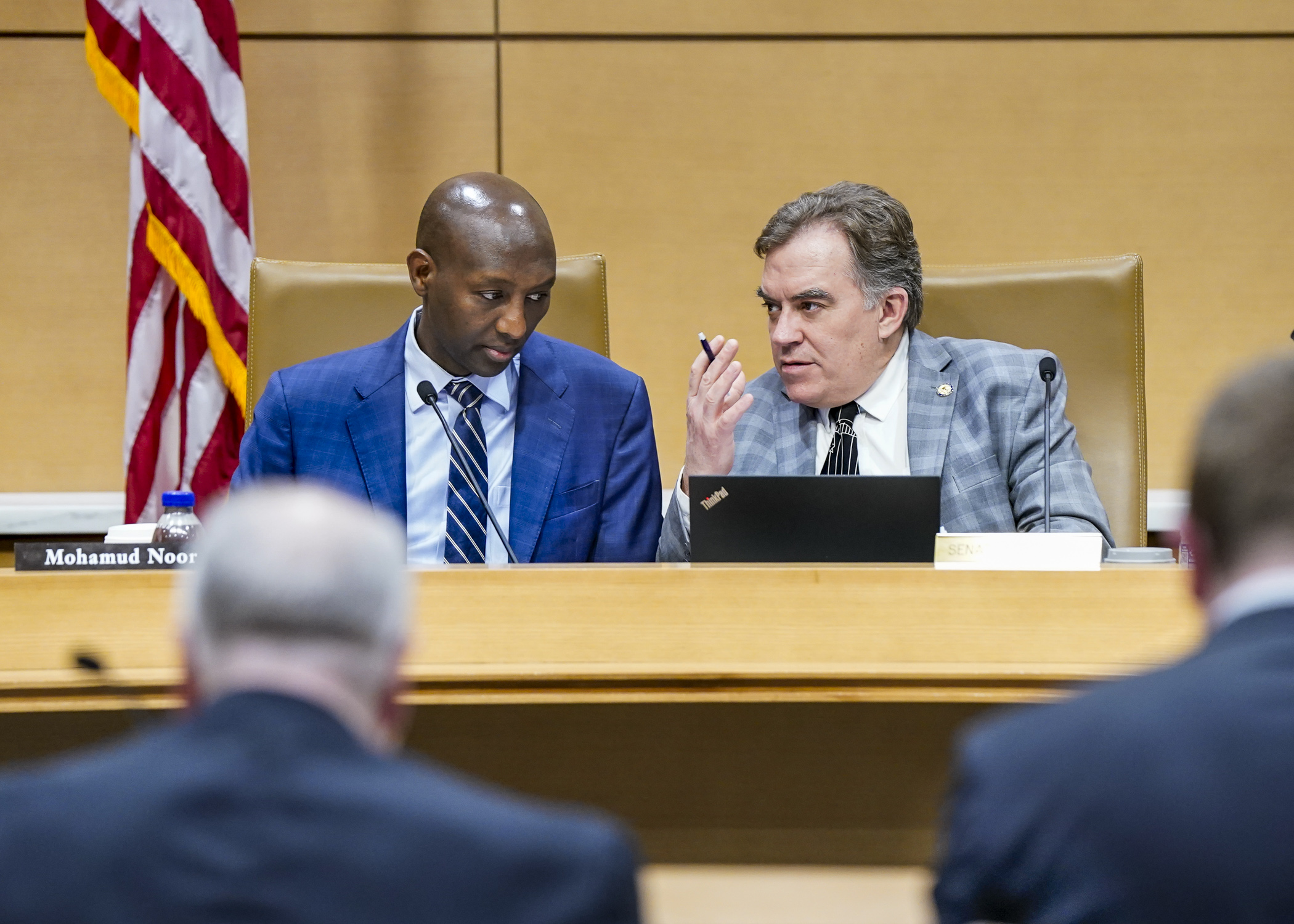 Rep. Mohamud Noor and Sen. John Hoffman discuss matters during a May 2 walkthrough of the bills before the omnibus human services finance conference committee. (Photo by Catherine Davis)