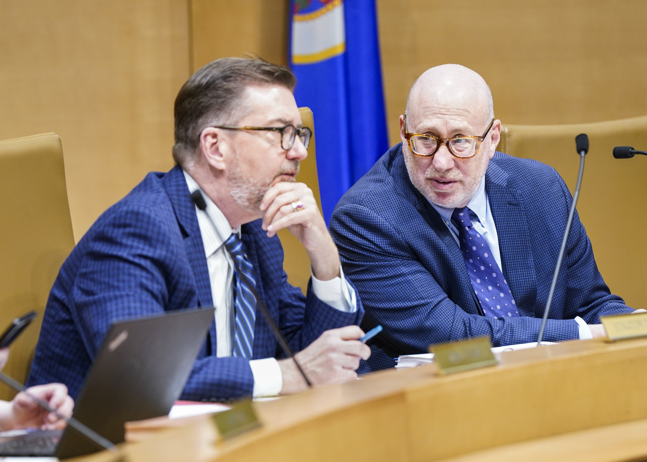 Sen. D. Scott Dibble and Rep. Frank Hornstein confer before the transportation conference committee begins May 3. The Minneapolis DFLers co-chair the committee. (Photo by Catherine Davis)