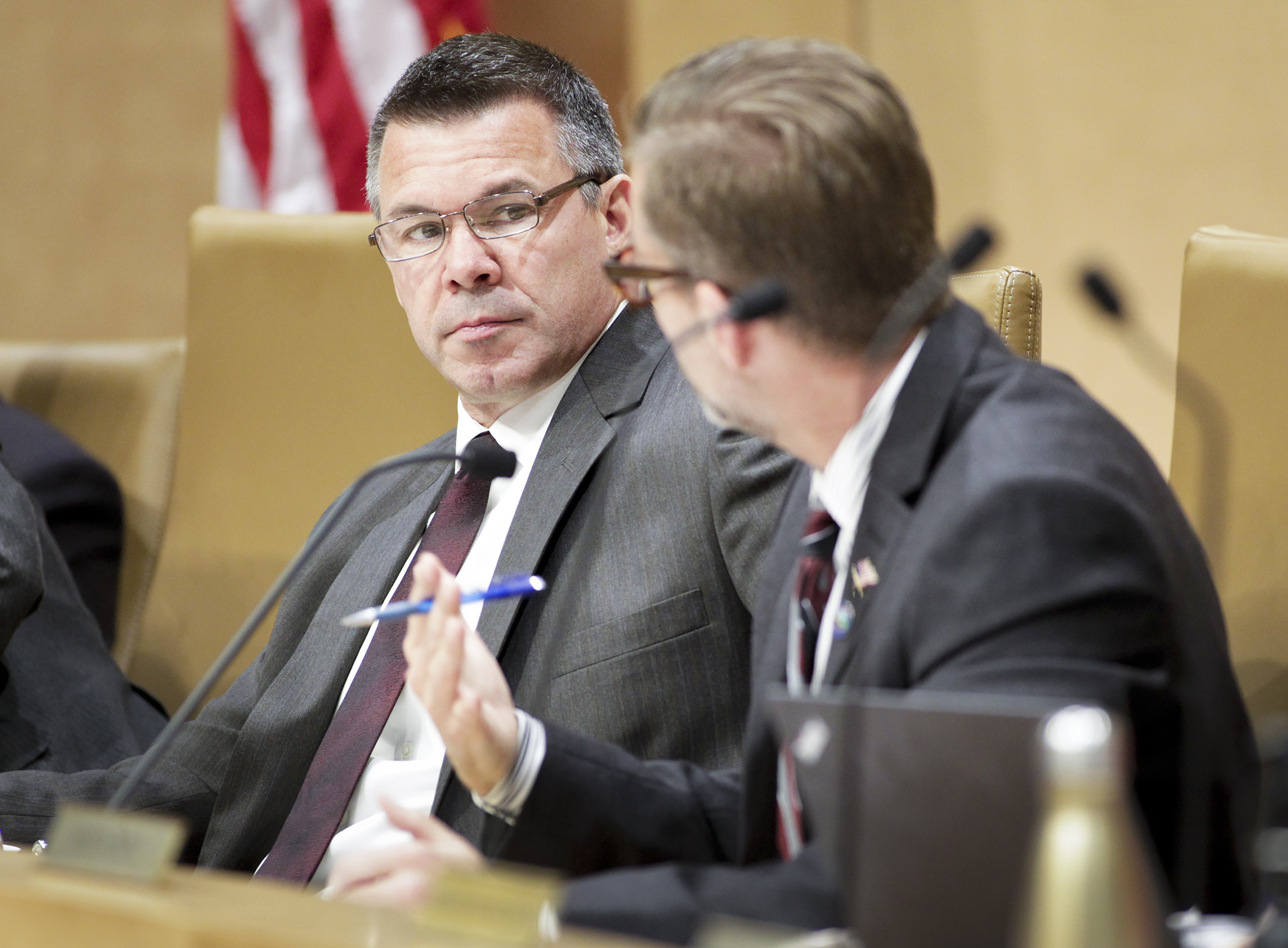 Rep. Tim Kelly, chair of the House Transportation Policy and Finance Committee, listens to Sen. Scott Dibble, chair of the Senate Transportation and Public Safety Committee, explain the Senate’s latest offer during the May 6 meeting of the transportation conference committee. Photo by Paul Battaglia