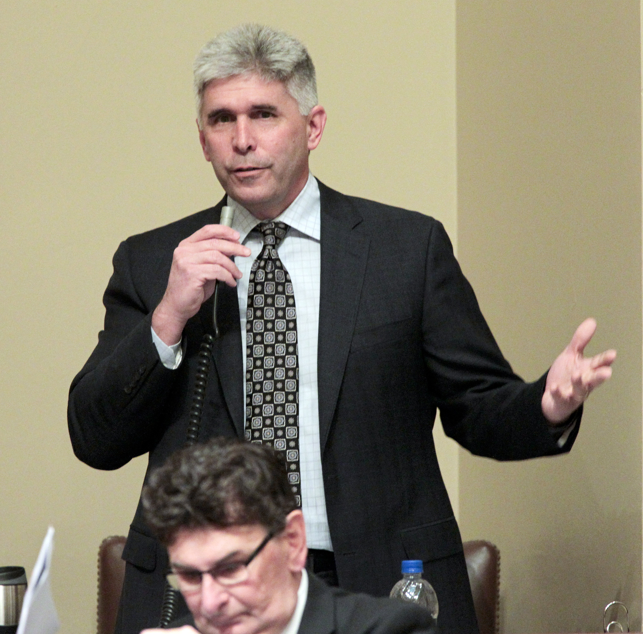Rep. Joe Atkins answers a member’s questions May 8 regarding his attempt to amend the House omnibus liquor bill, minus a provision to allow Sunday growler sales, to SF2336. Photo by Paul Battaglia