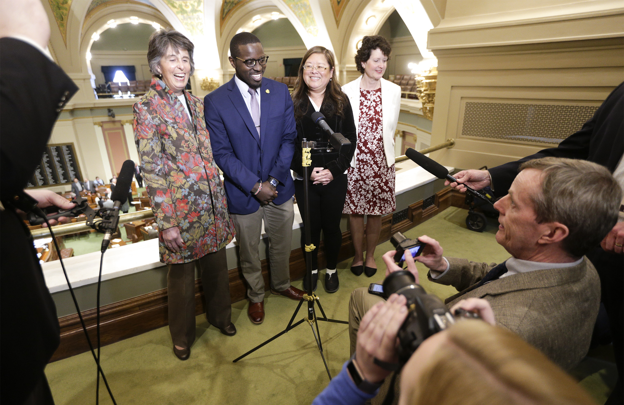 Newly elected University of Minnesota Regents Janie Mayeron, from left, Mike Kenyanya, Kao Ly Ilean Her and Mary Davenport gather to speak with the media after being chosen by a joint convention of the Legislature May 9. Photo by Paul Battaglia