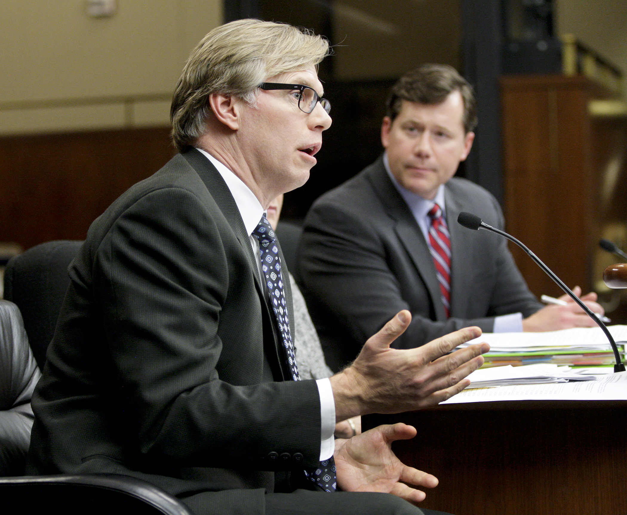 Paul Meekin, chief information officer for MN.IT Services, answers a members question during May 11 testimony in the House Ways and Means Committee on HF3959, sponsored by Rep. Dennis Smith, right, which authorizes implementation of the Real ID act. Photo by Paul Battaglia