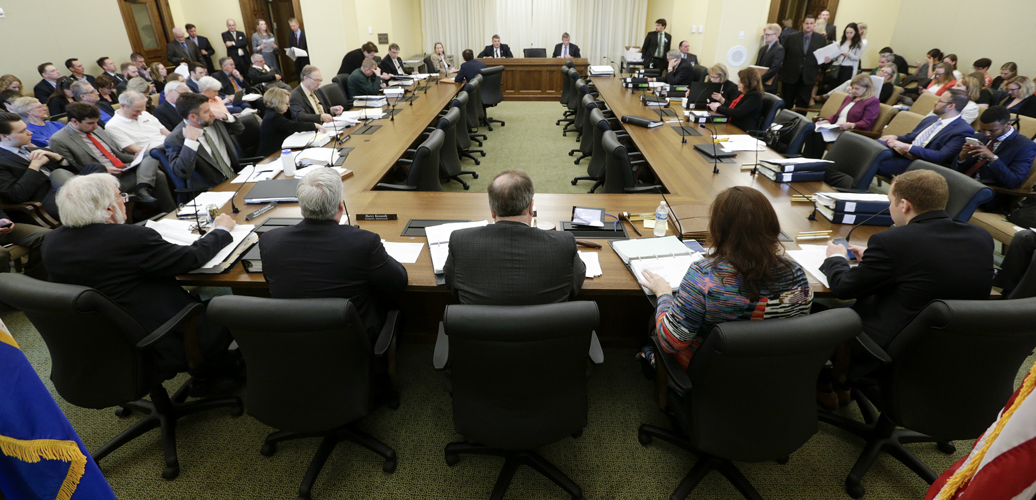 Members of the omnibus supplemental budget bill conference committee begin their May 14 meeting. Photo by Paul Battaglia