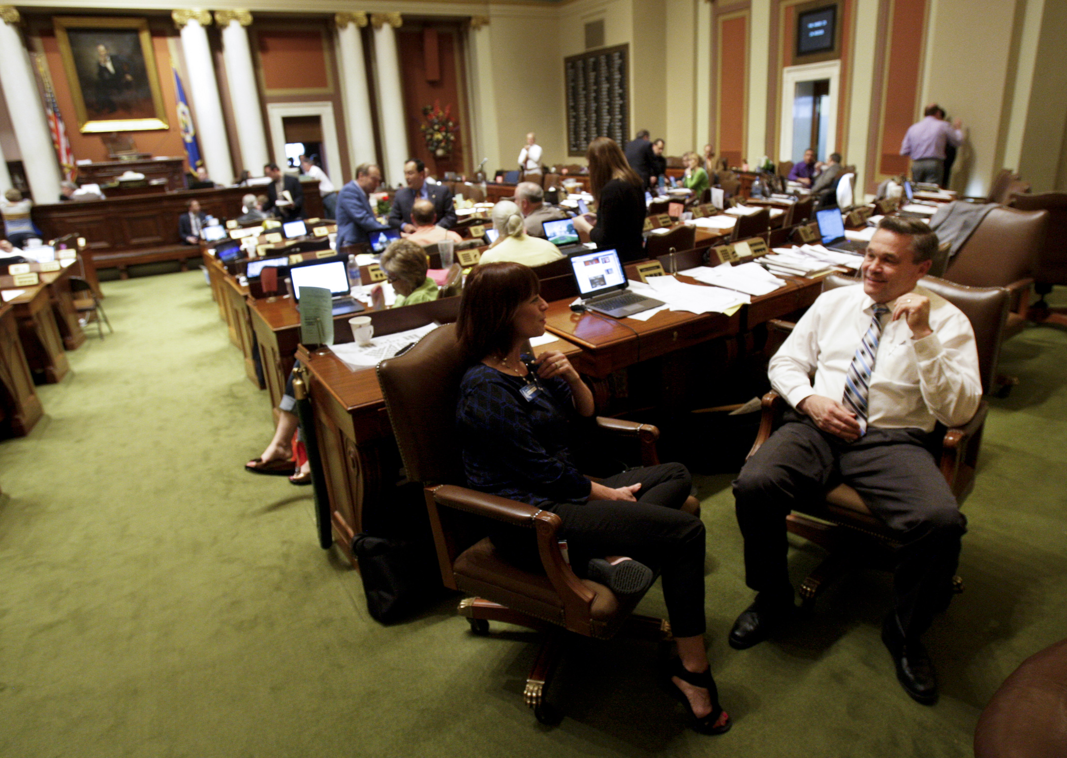 Rep. Glenn Gruenhagen and House page, Barbara Smith, chat during an early evening House recess May 17. Earlier the House had voted to be allowed to meet past midnight. Photo by Paul Battaglia