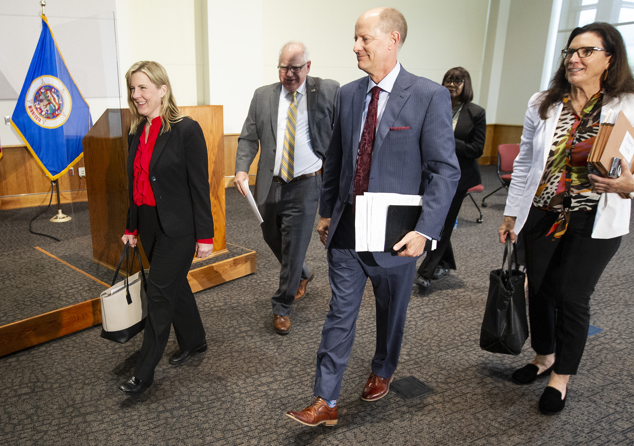 House Speaker Melissa Hortman, left, Gov. Tim Walz, Senate Majority Leader Paul Gazelka, and Sen. Julie Rosen leave a May 17 press conference where they announced a two-year budget agreement. Photo by Paul Battaglia