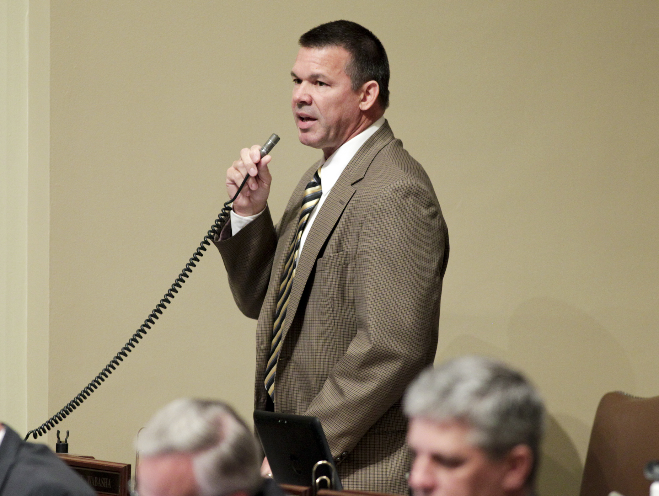 Rep. Tim Kelly, chair of the House Transportation Policy and Finance Committee, explains provisions of the conference committee report on SF1647, the omnibus transportation finance and policy bill, during floor debate May 18. Photo by Paul Battaglia