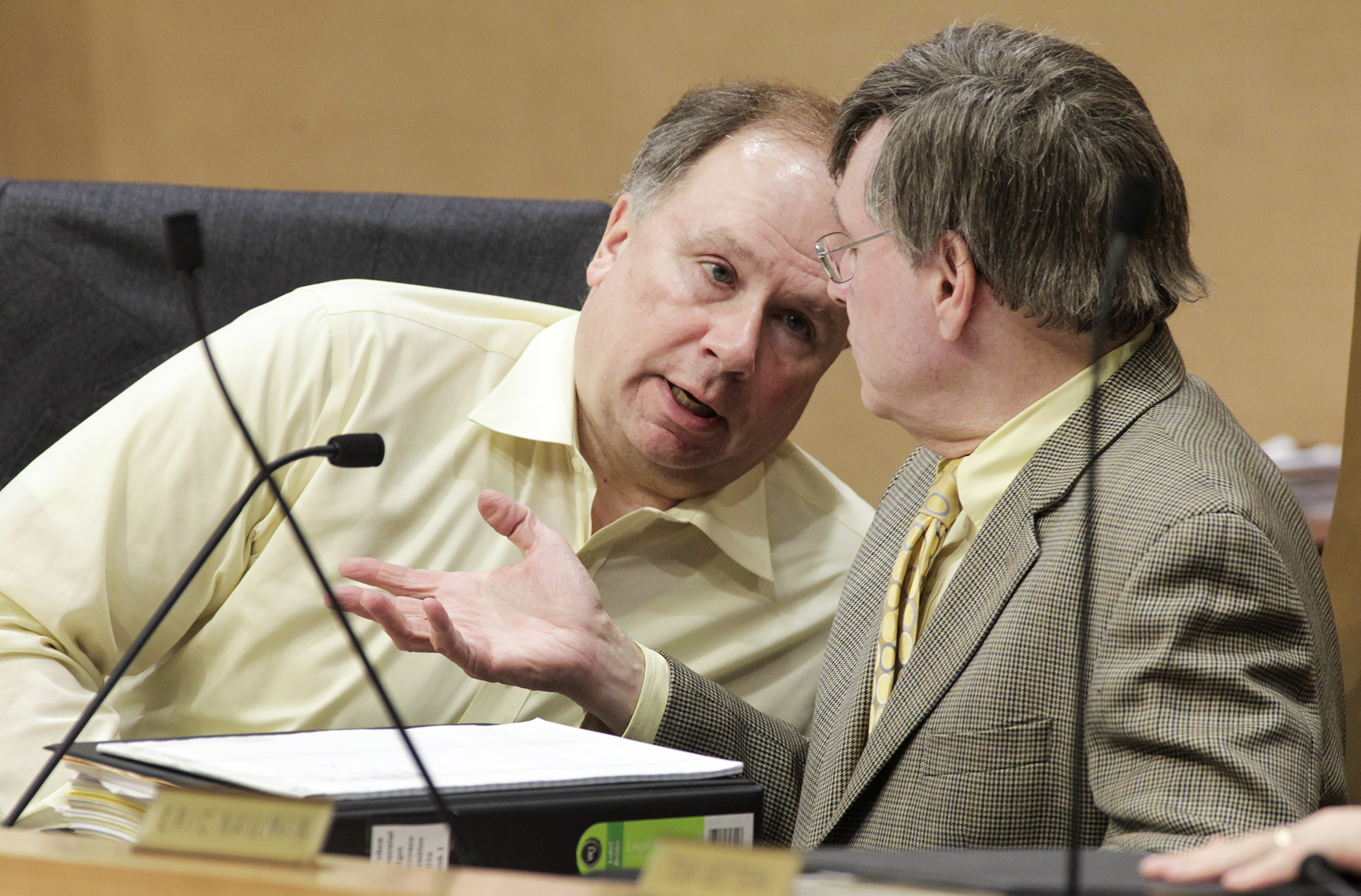 Rep. Jim Knoblach leans in to confer with Sen. Richard Cohen, co-chair of the supplemental spending bill conference committee, during an afternoon meeting May 21. Photo by Paul Battaglia