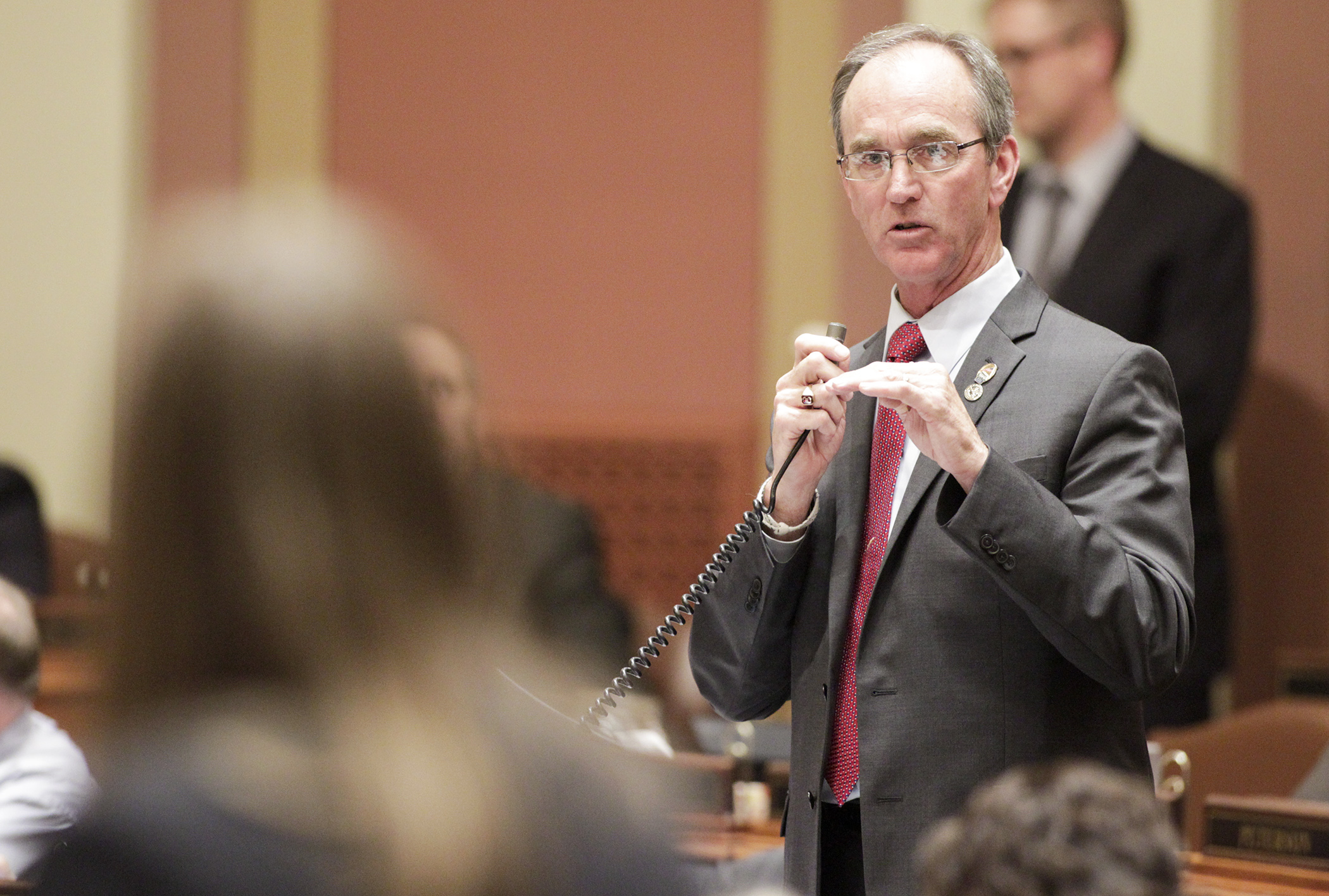 Rep. Dan Fabian answers a question from Rep. Jamie Becker-Finn during May 21 Floor debate on the omnibus environment and natural resources finance conference committee report. Photo by Paul Battaglia 