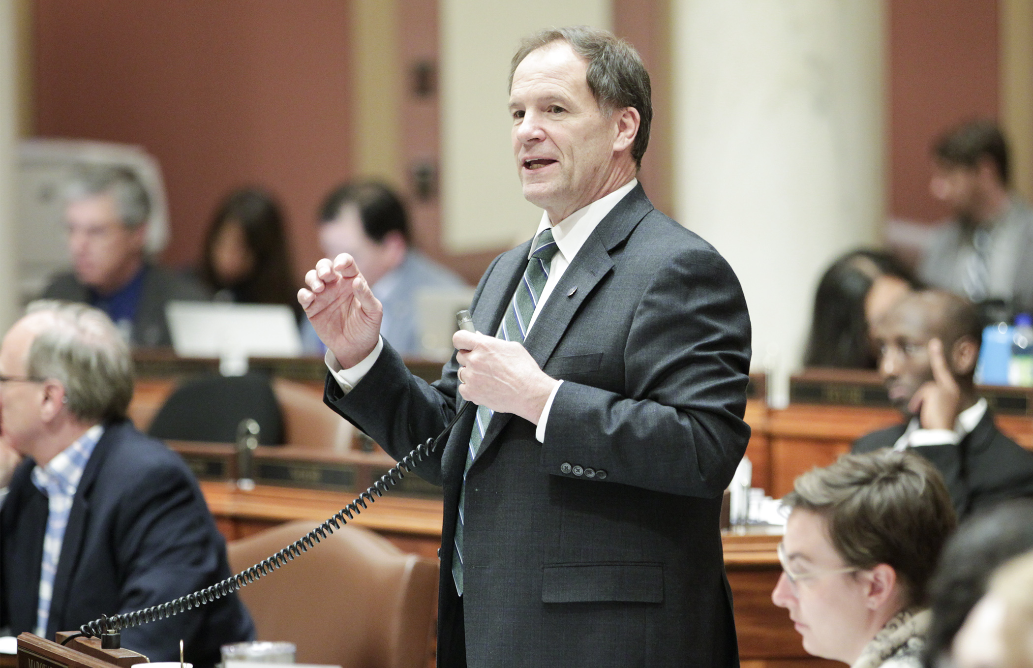 Rep. Paul Marquart, chair of the House Taxes Committee, describe provisions of the omnibus tax bill during special session floor debate May 25. Photo by Paul Battaglia