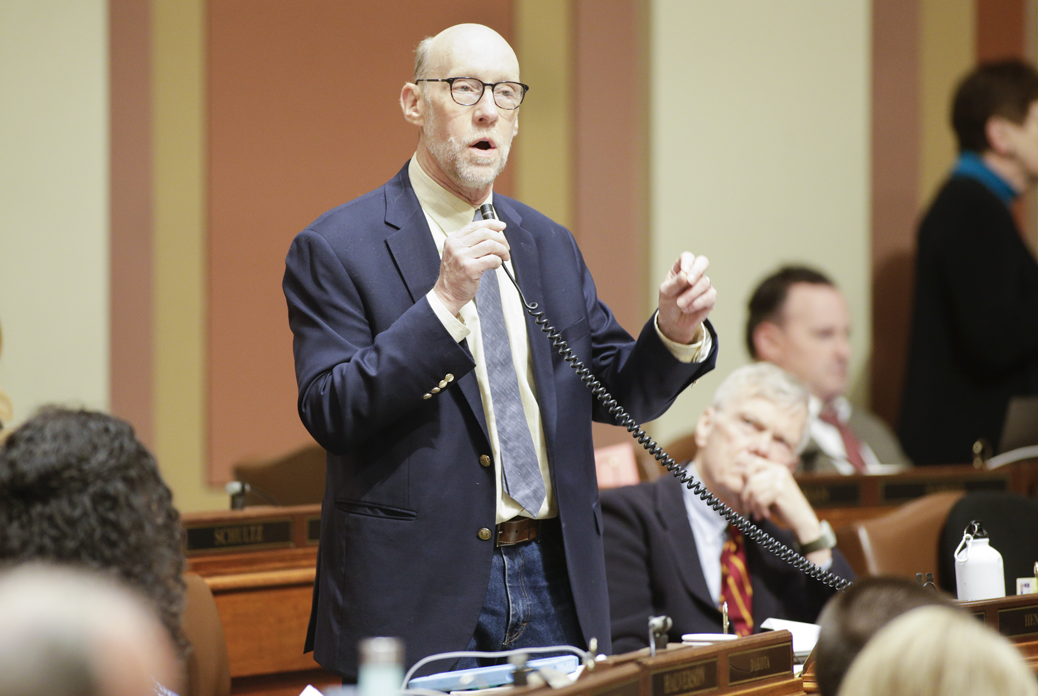 Rep. Jim Davnie, chair of the House Education Finance Division, describes provisions of the omnibus education finance and policy bill during special session floor debate May 25.